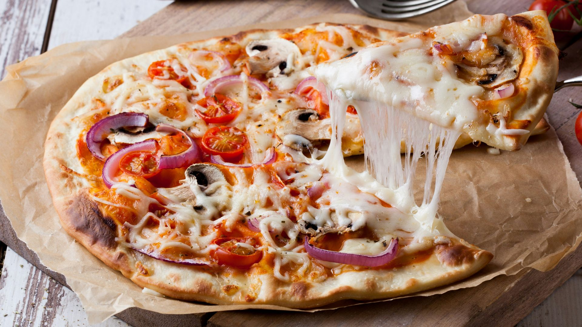 pizza on brown wooden tray
