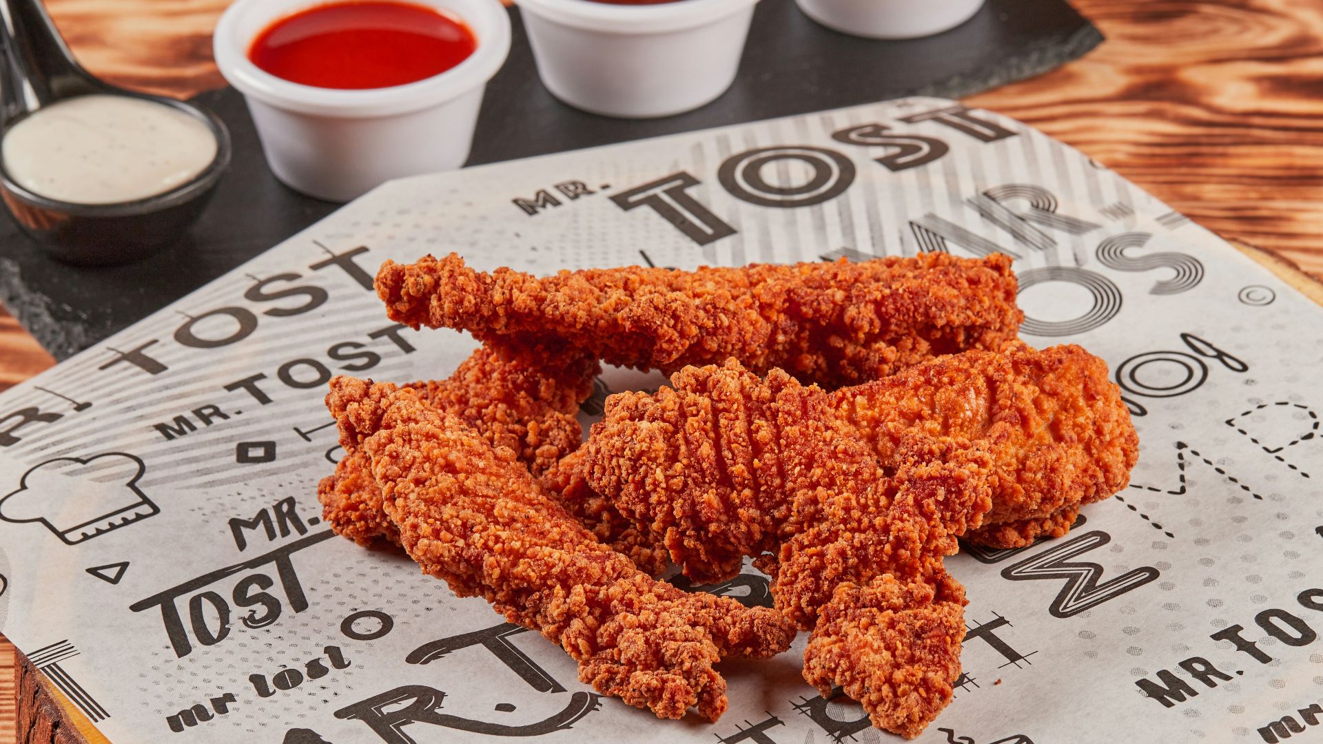 fried chicken on brown wooden chopping board