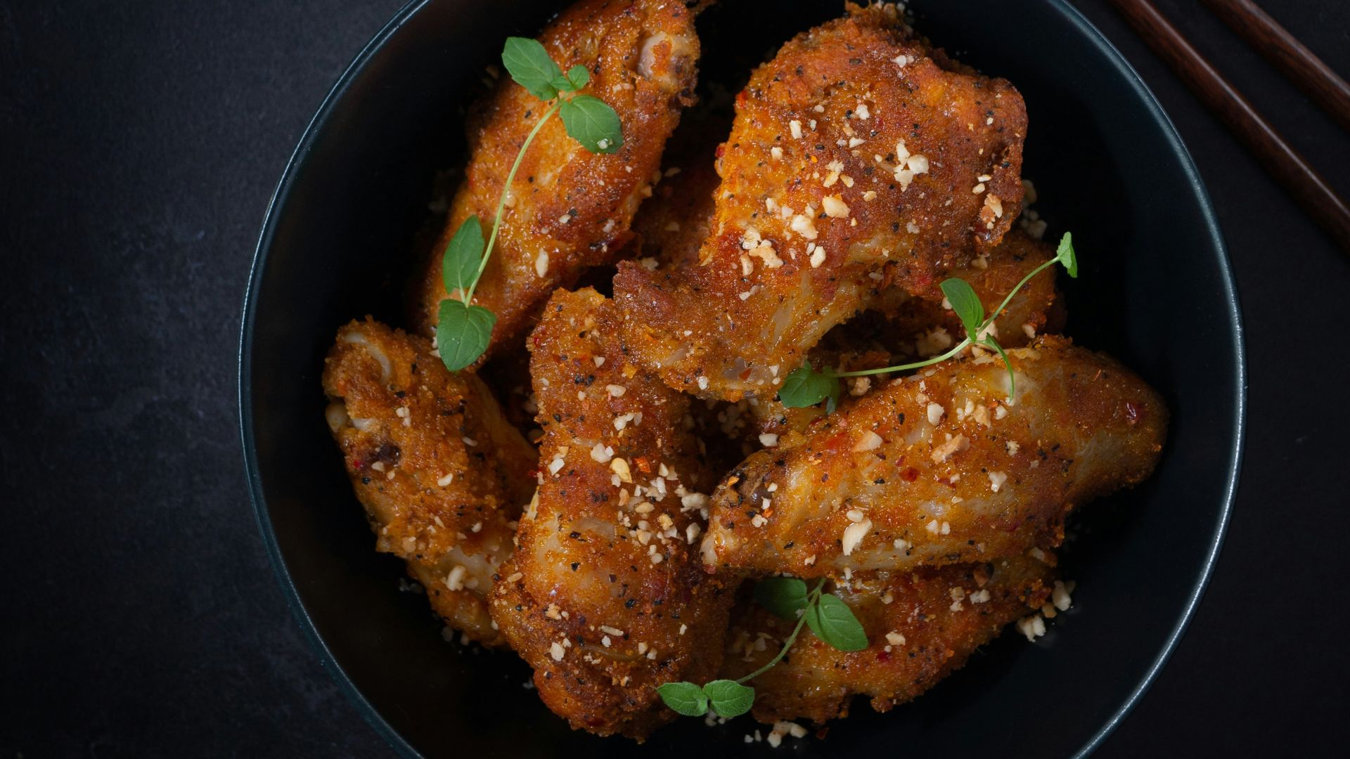 fried chicken on black frying pan