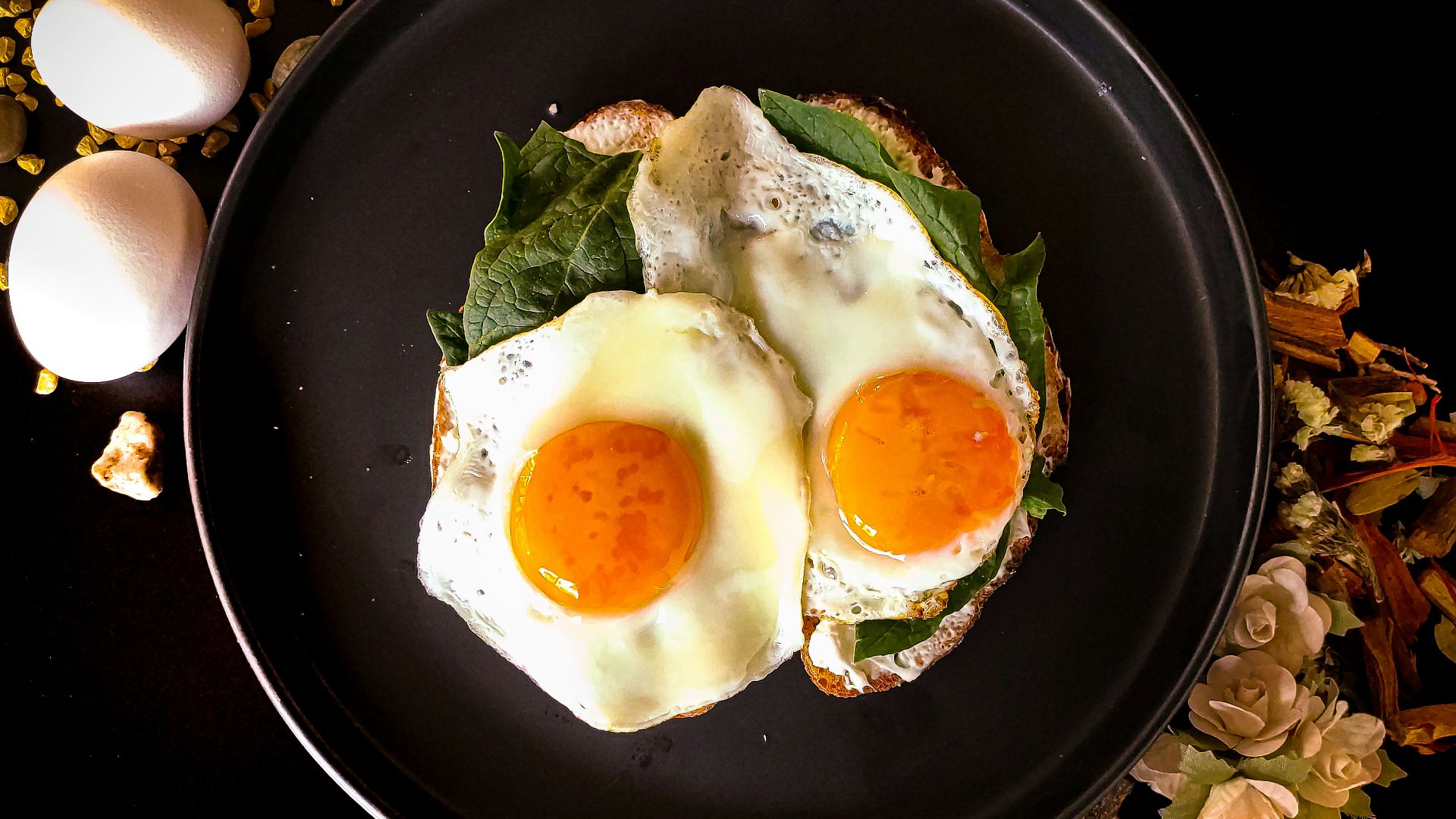 sunny side up egg on black ceramic plate