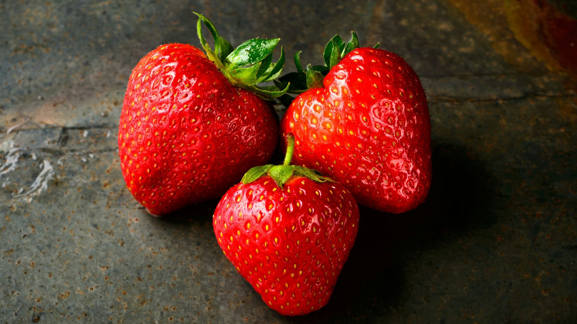 three red strawberries