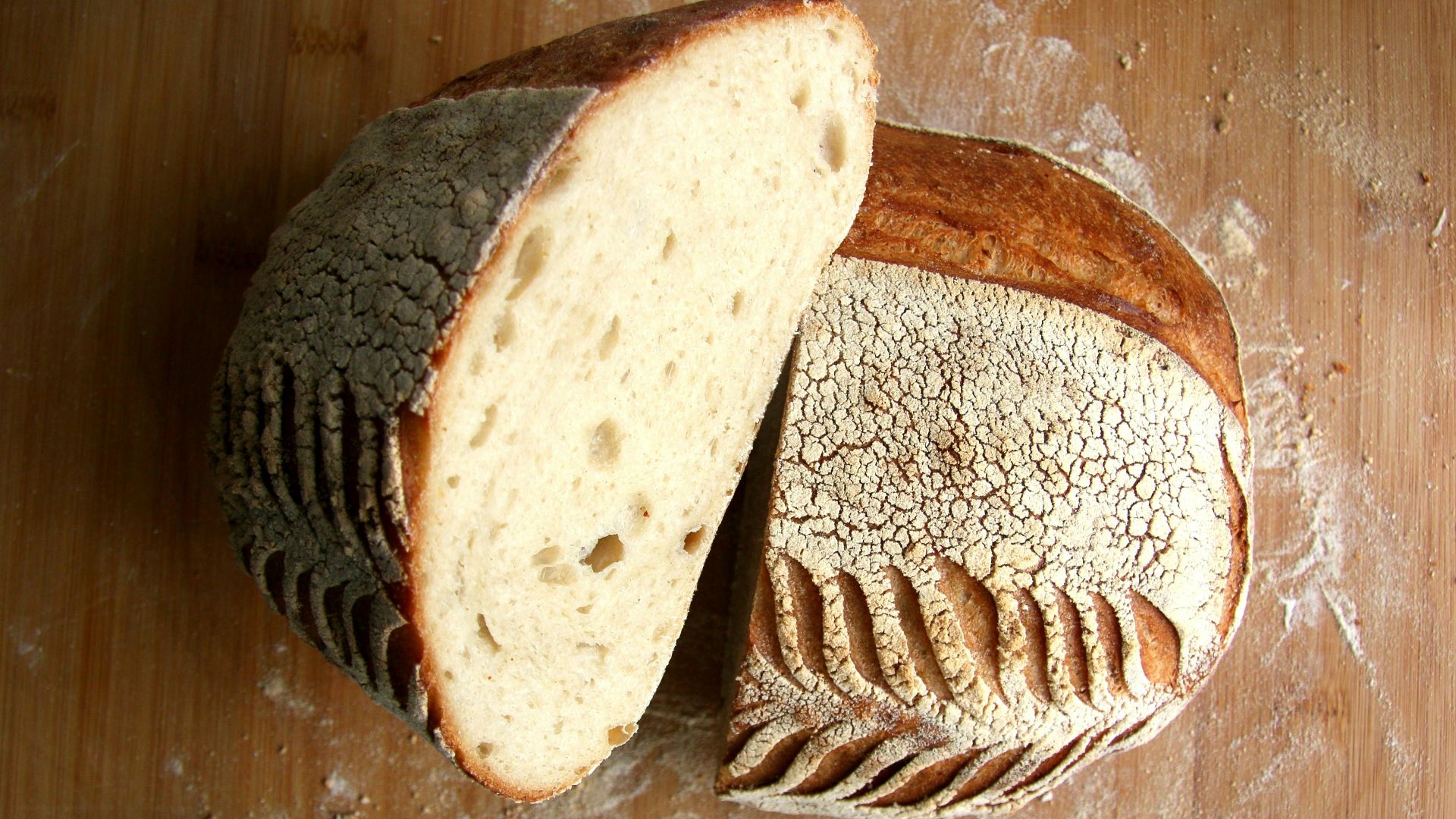 sliced bread on brown wooden chopping board