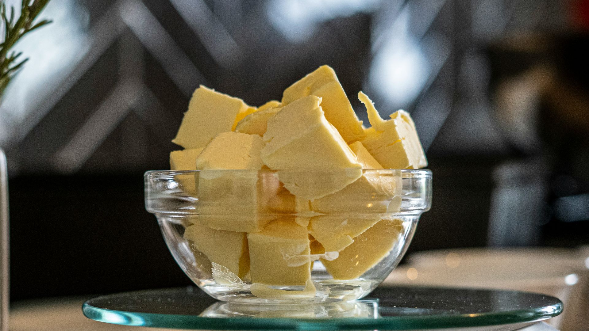 yellow cheese on green and white ceramic plate