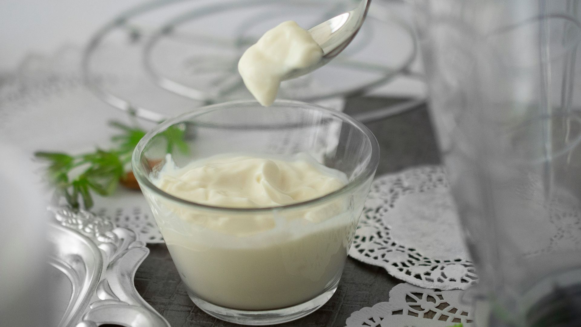 close-up photo of white cream in clear shot glass