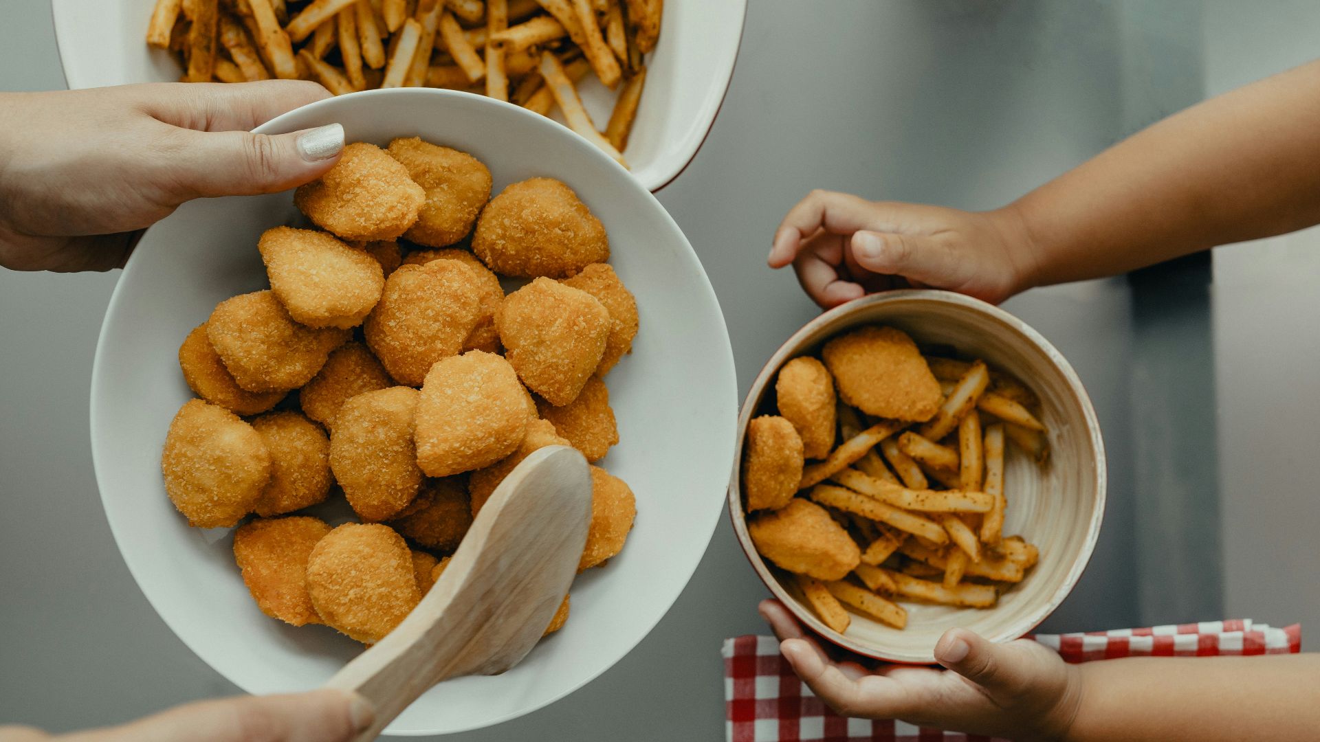 brown potato fries on white ceramic bowl