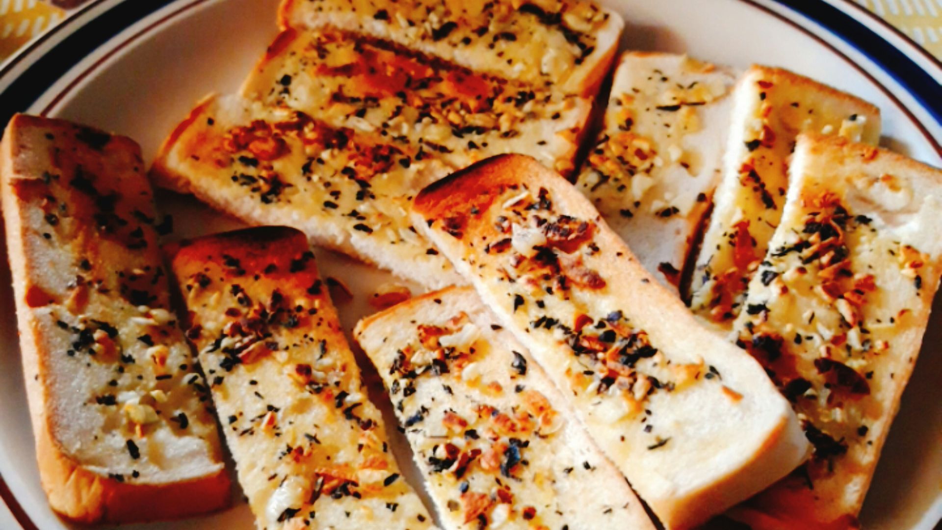 sliced pizza on blue and white ceramic plate