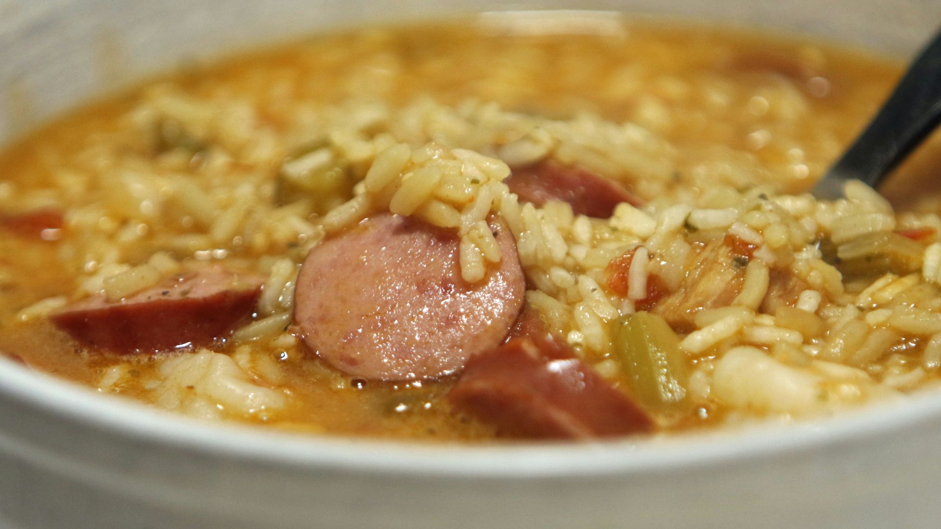 a bowl of soup with a spoon in it
