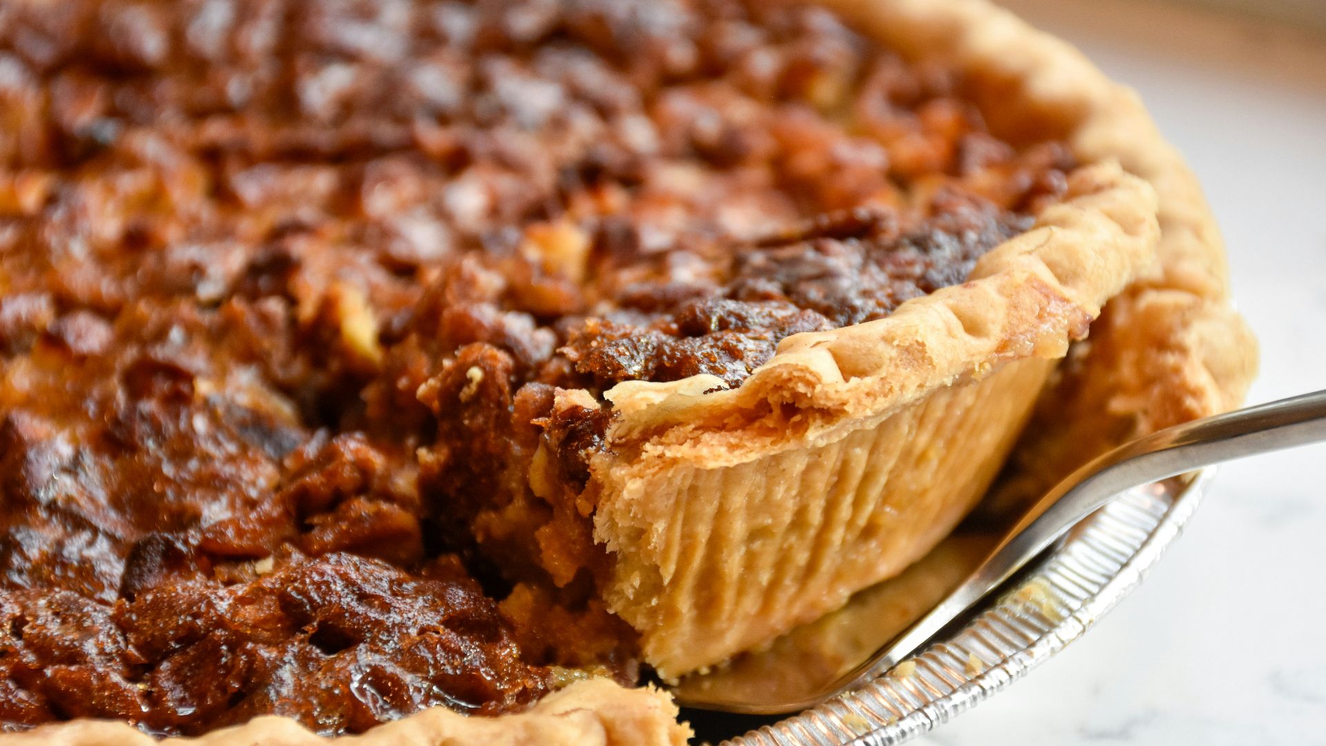 brown pie on white ceramic plate