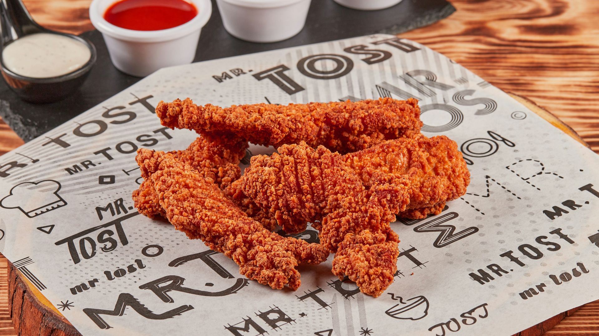 fried chicken on brown wooden chopping board