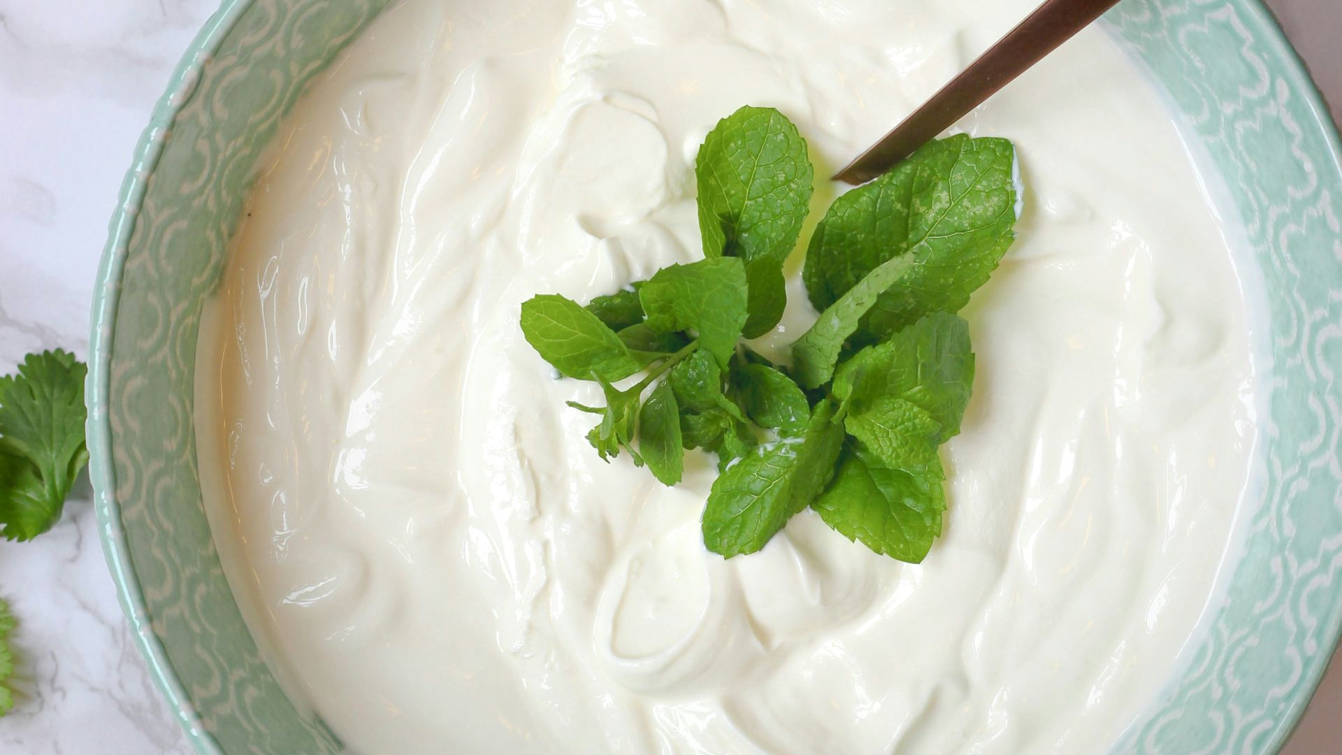 a bowl of yogurt with a spoon in it