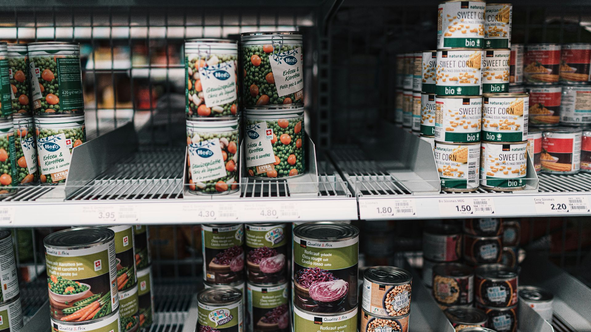 white and red labeled cans