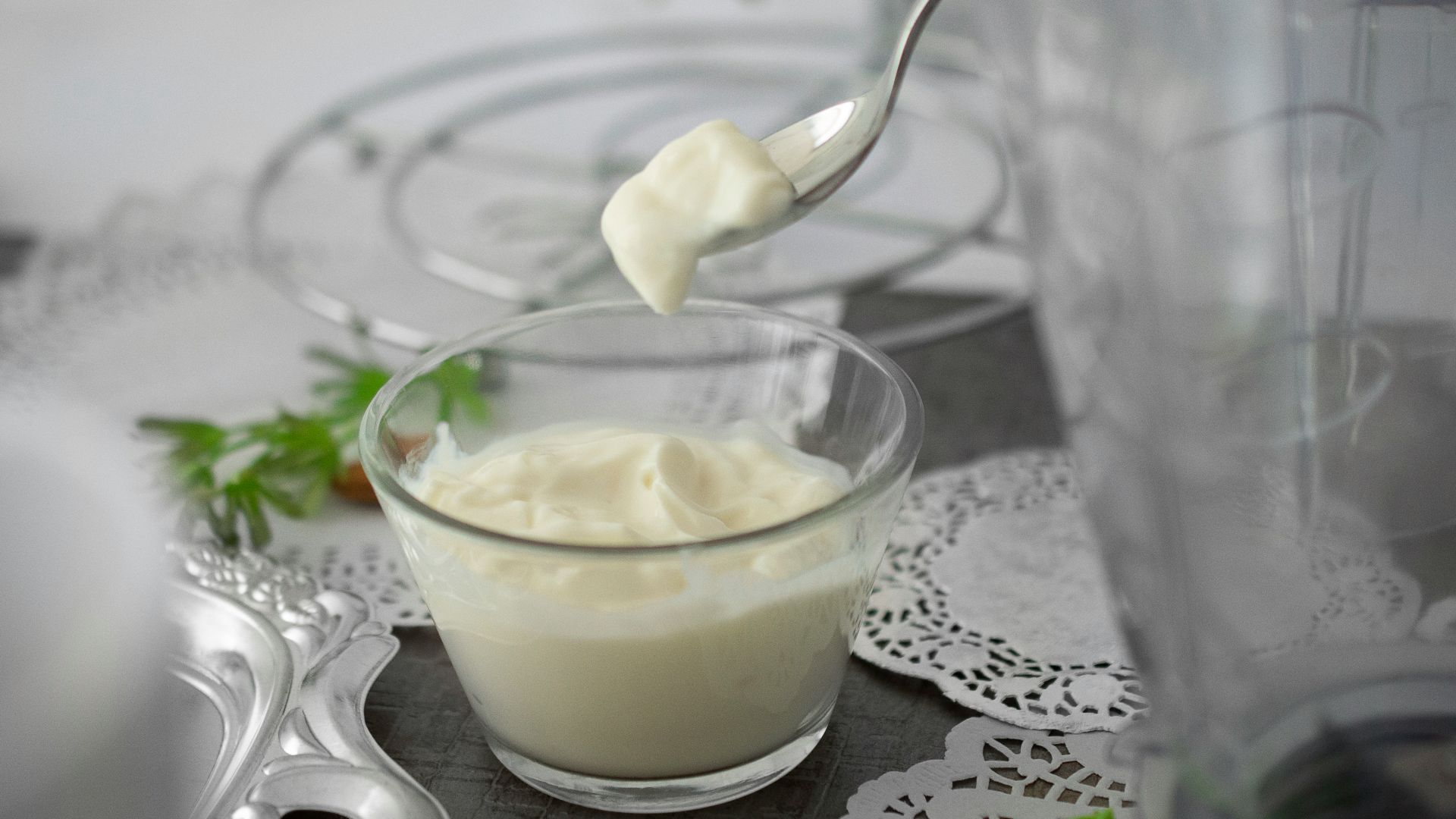 close-up photo of white cream in clear shot glass