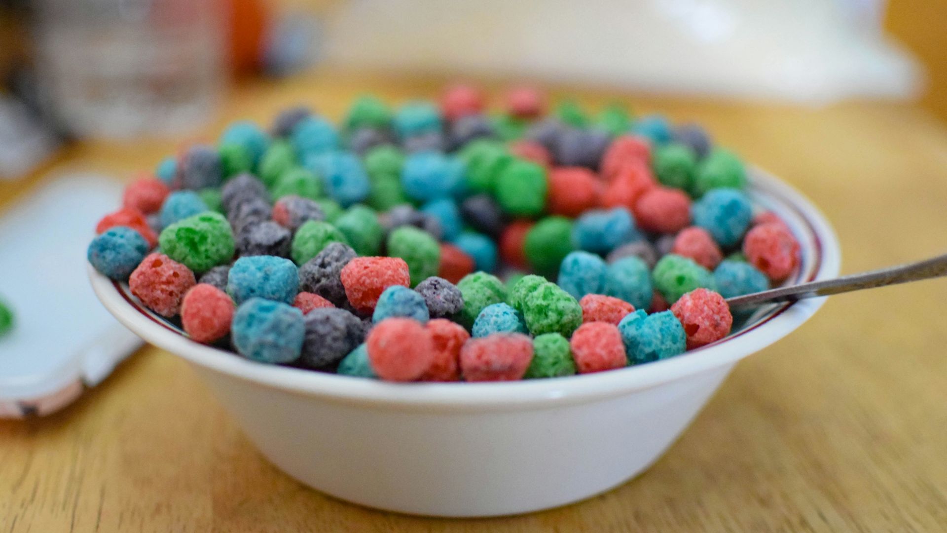 white ceramic bowl with assorted color of beads