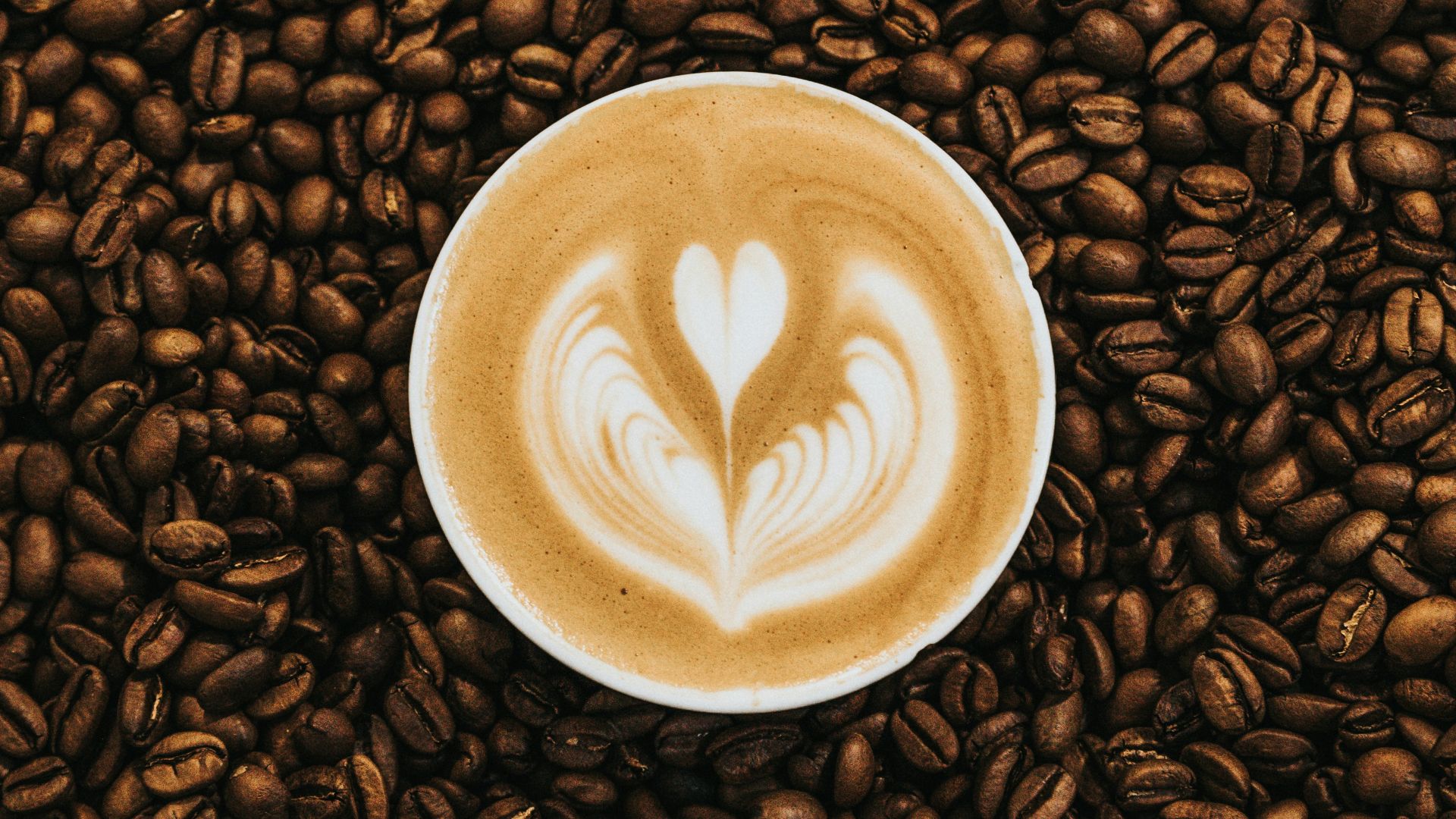 top view photography of heart latte coffee