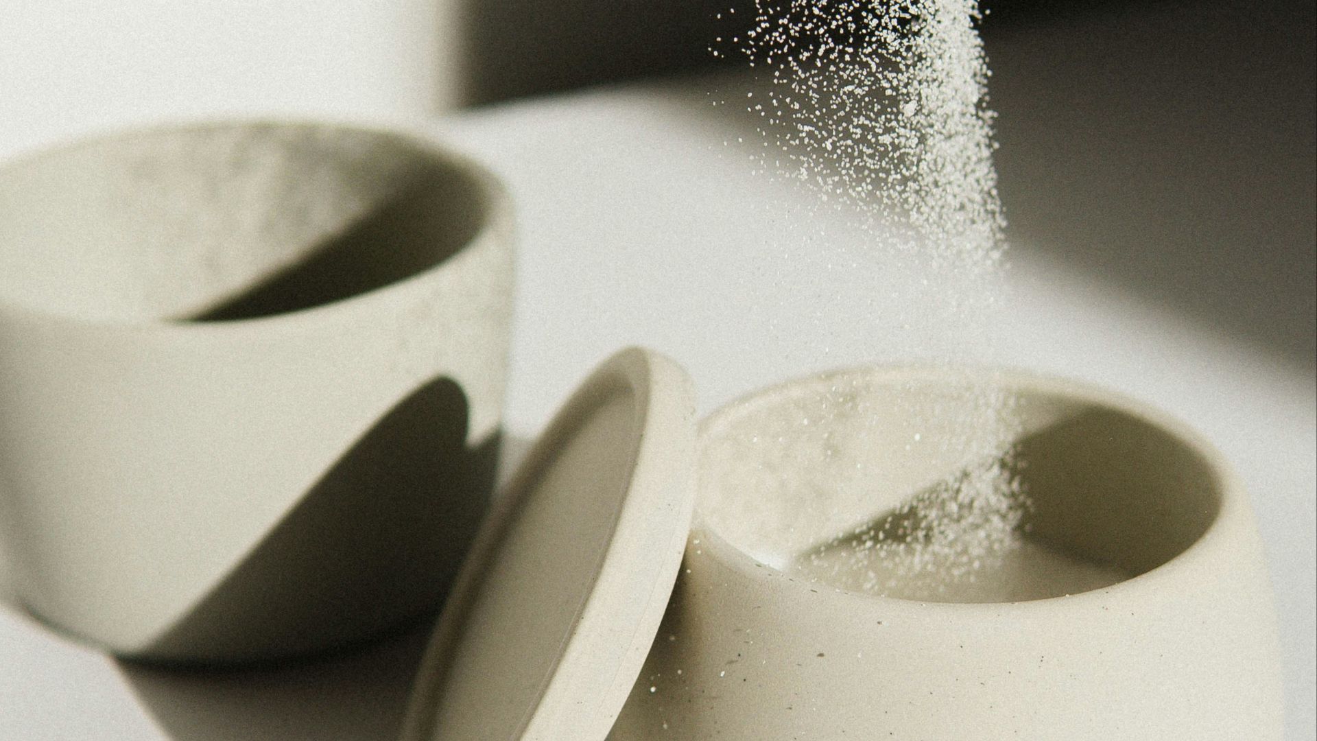 white ceramic bowl on white table
