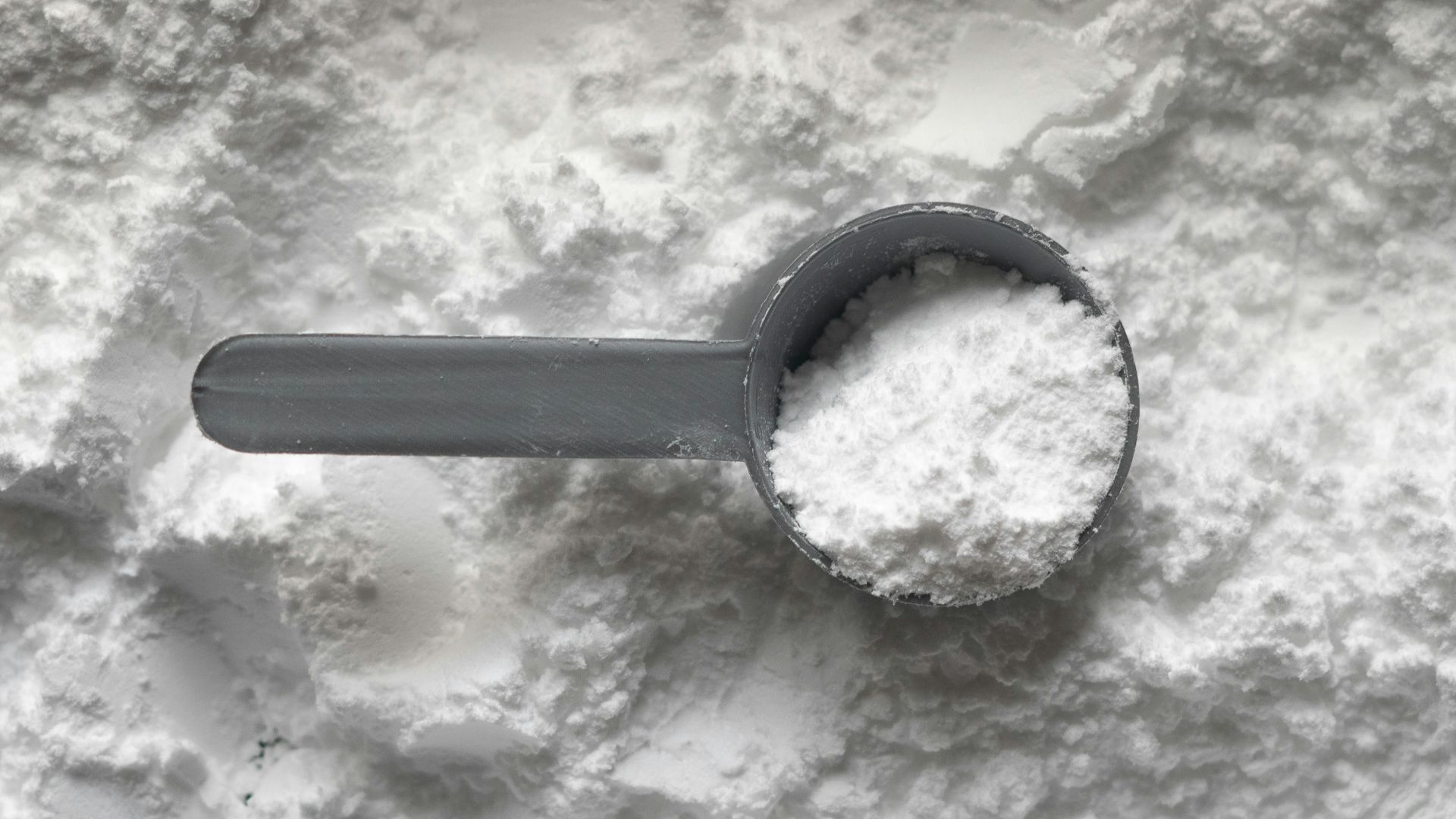 black magnifying glass on white and brown marble table