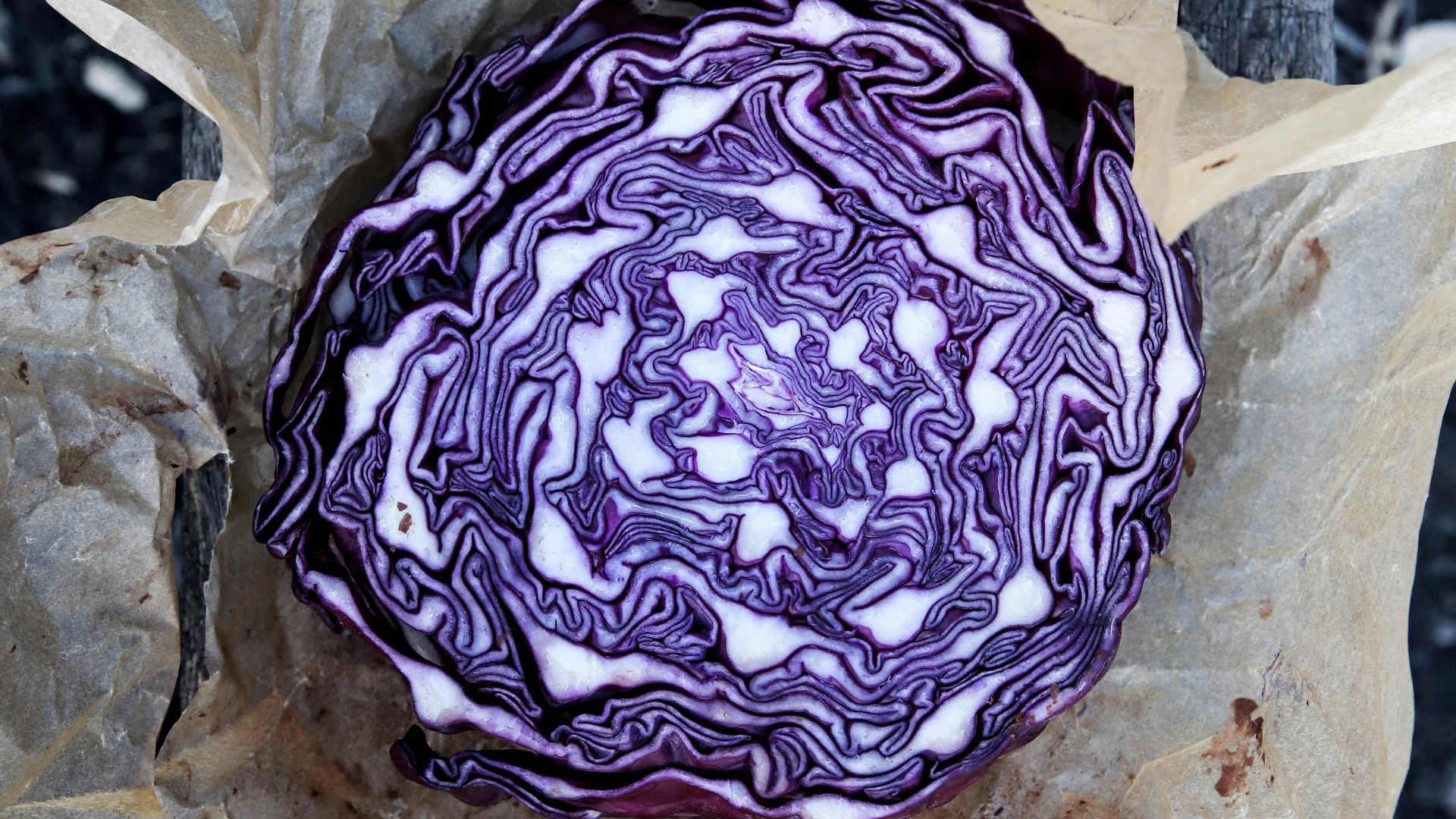 purple and white stone on white paper