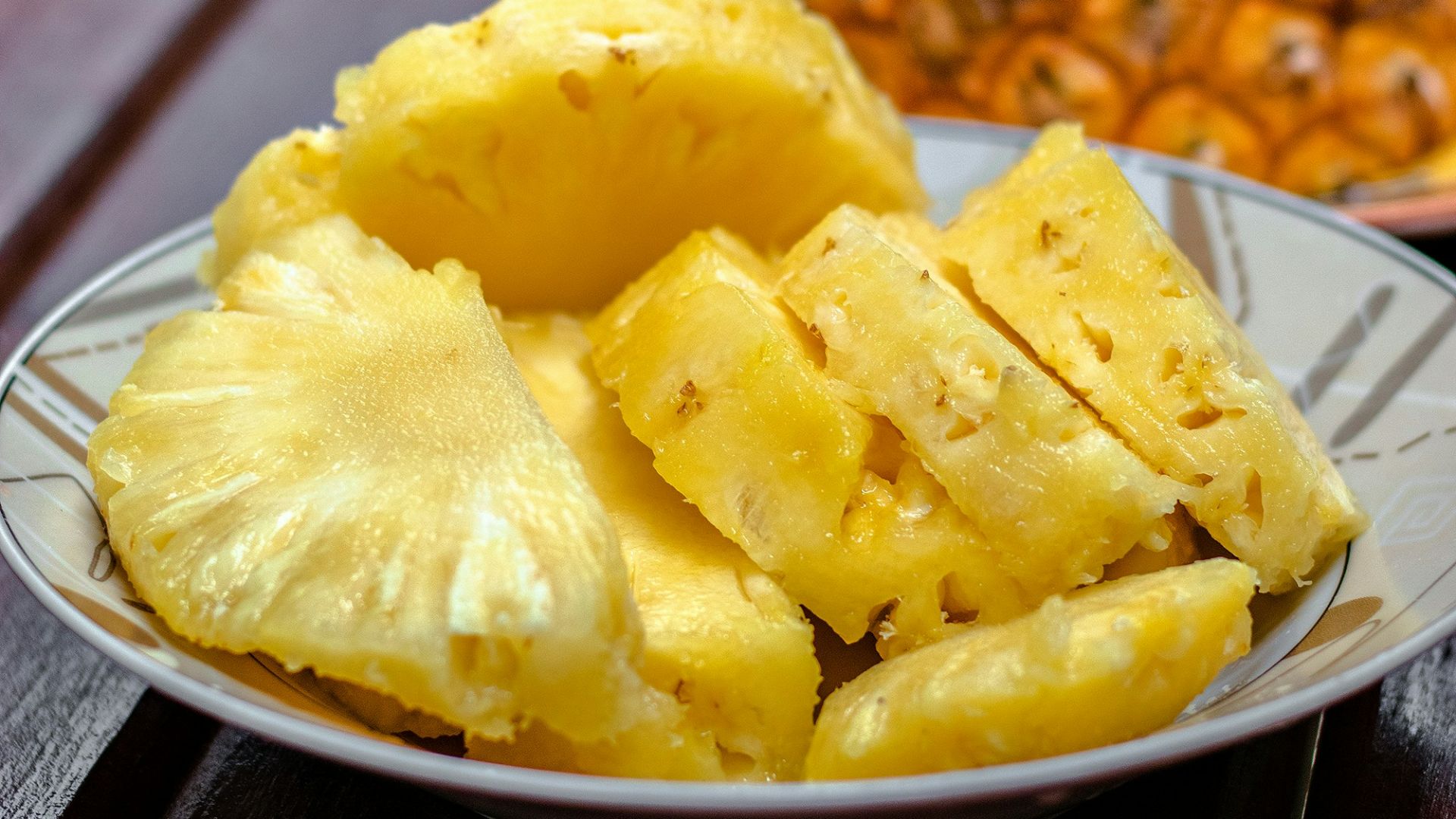 sliced pineapple on white ceramic plate