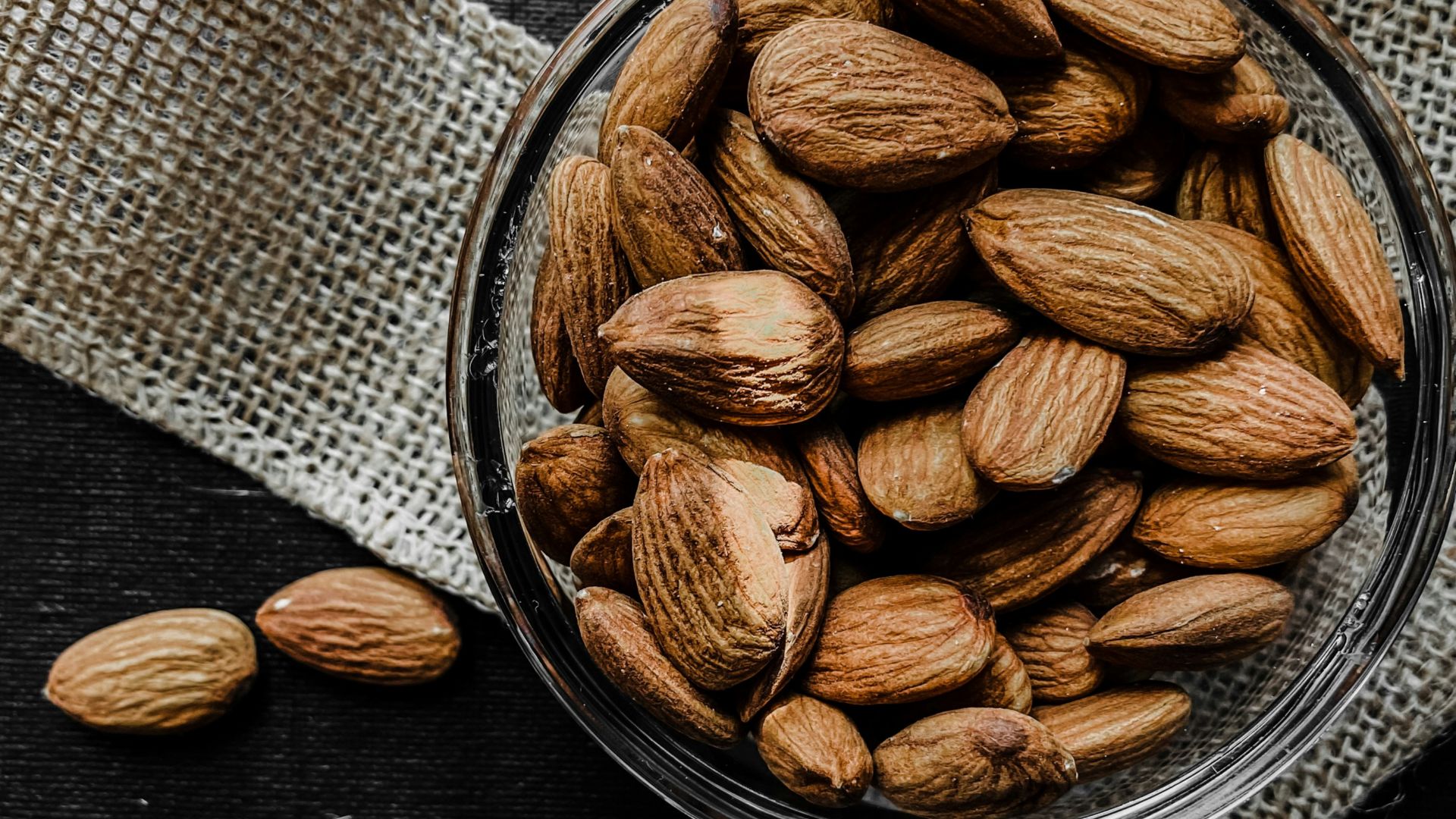 brown almond nuts on stainless steel bowl