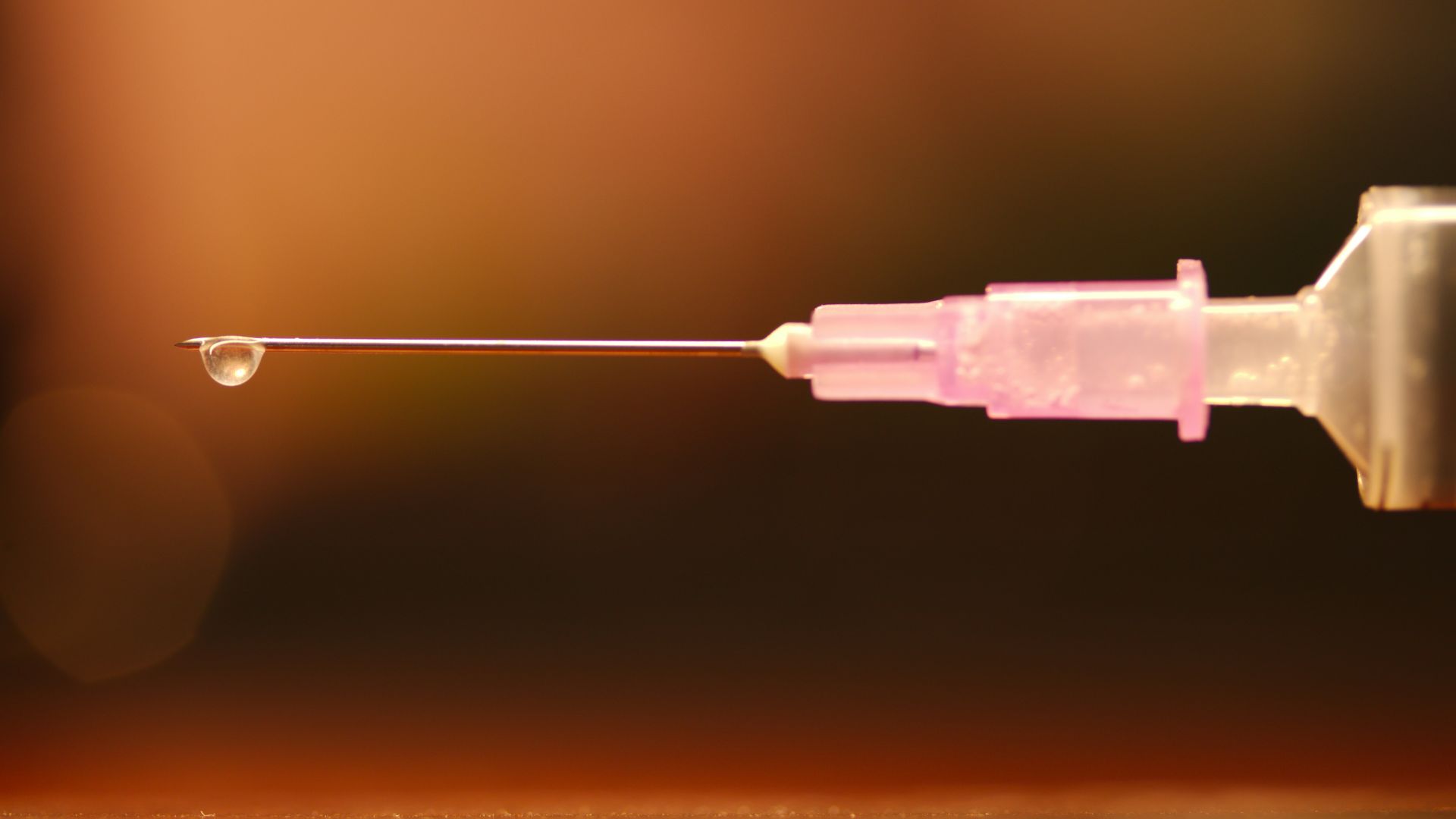 blue plastic tube with black string