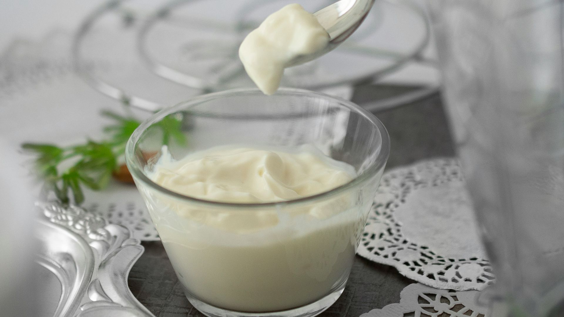 close-up photo of white cream in clear shot glass