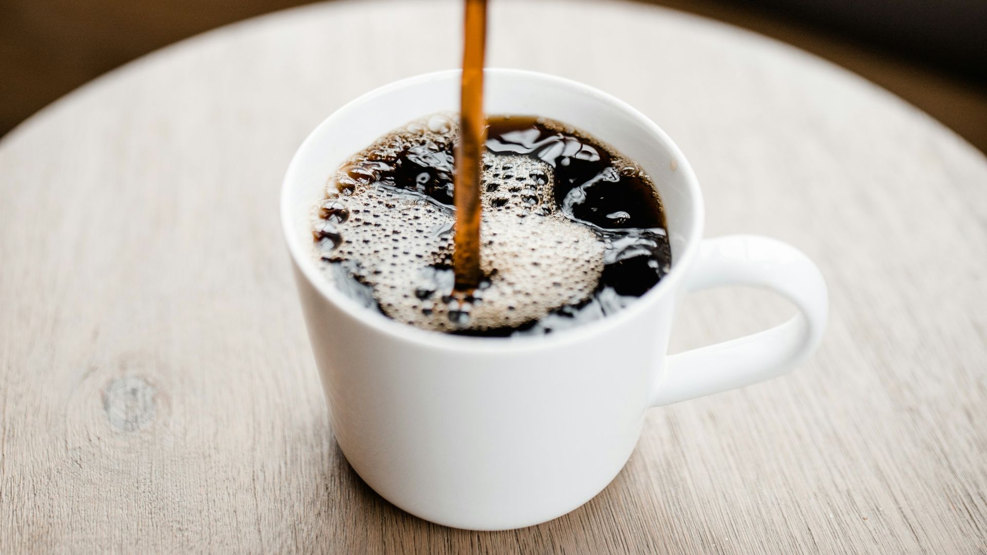 white ceramic mug with coffee
