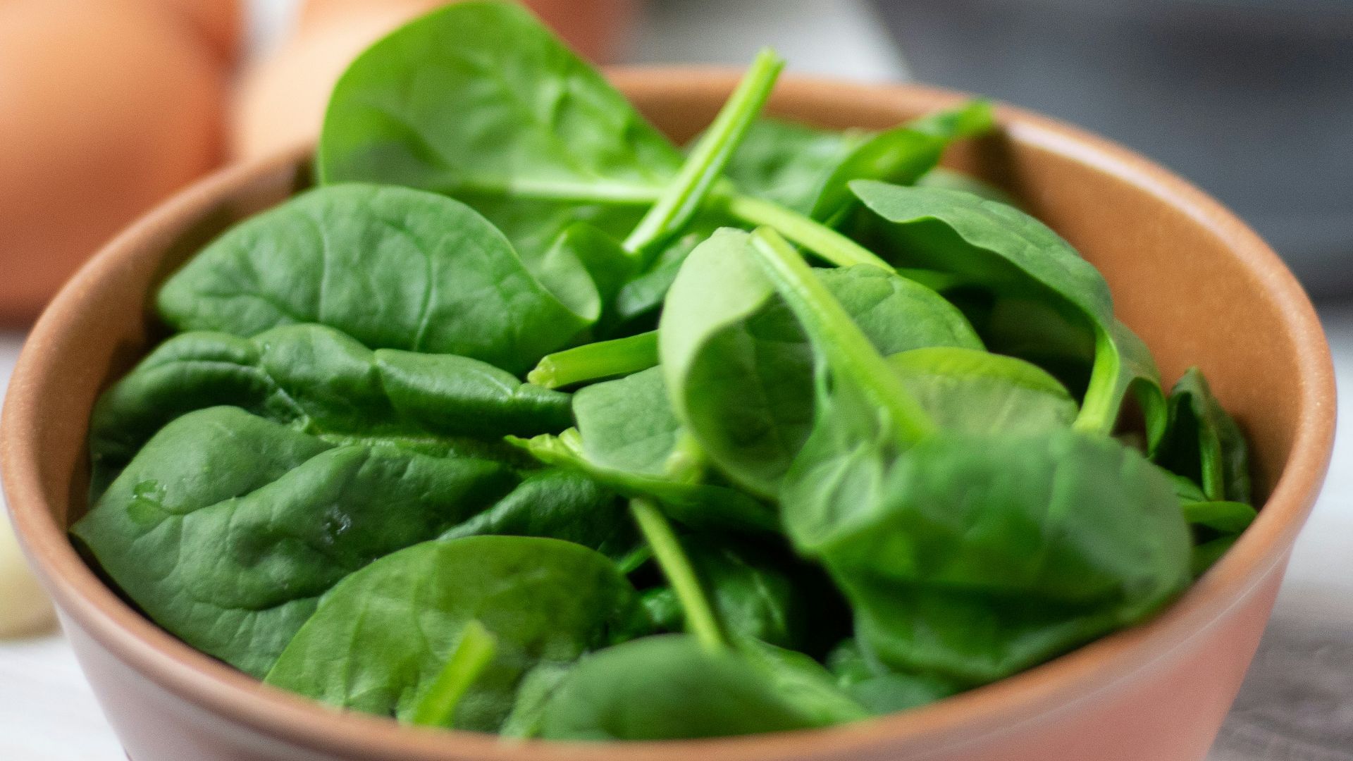 green vegetable on white ceramic bowl