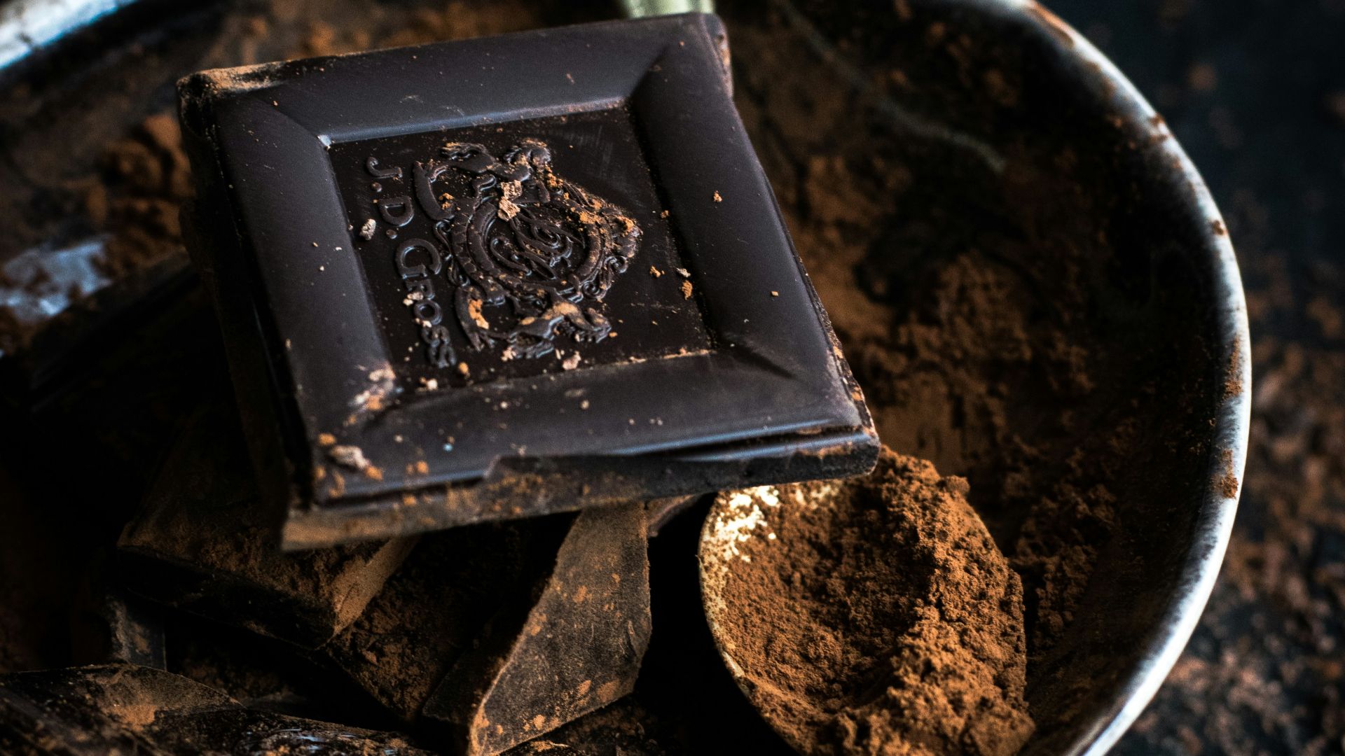chocolate bar and powder in bowl