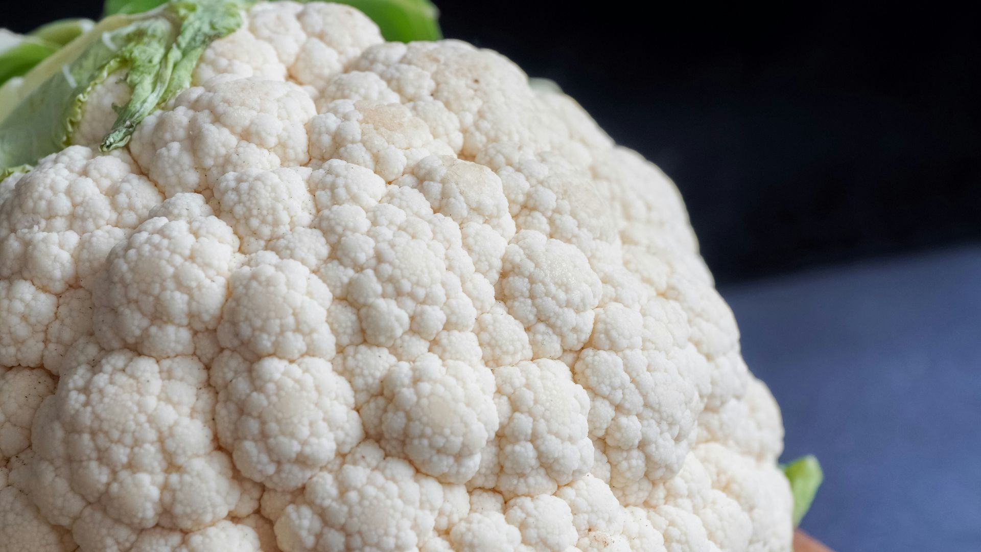 white cauliflower on black textile