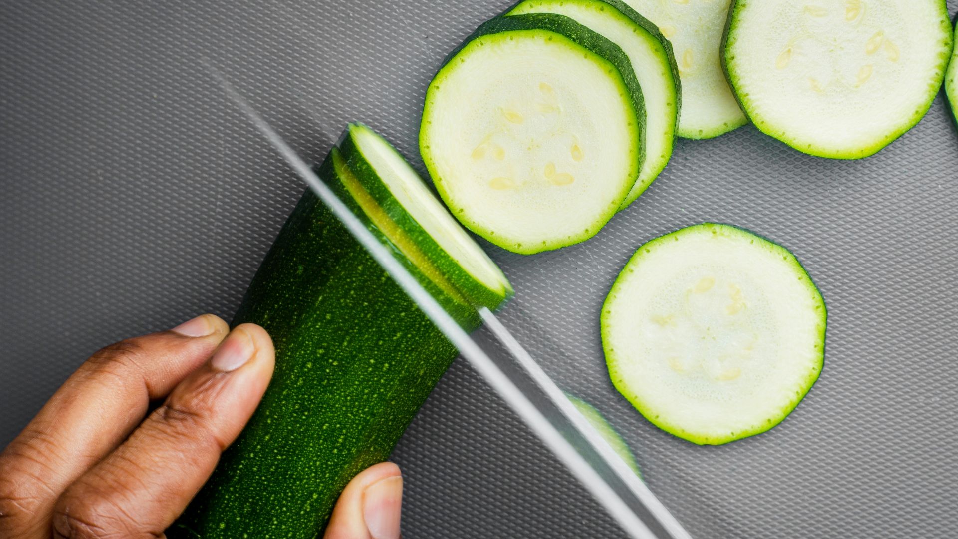 sliced cucumber on black textile