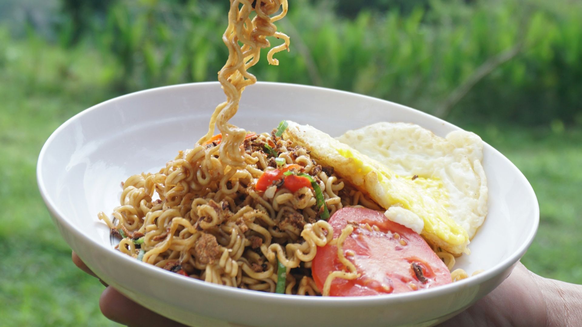 yellow pasta on white ceramic bowl