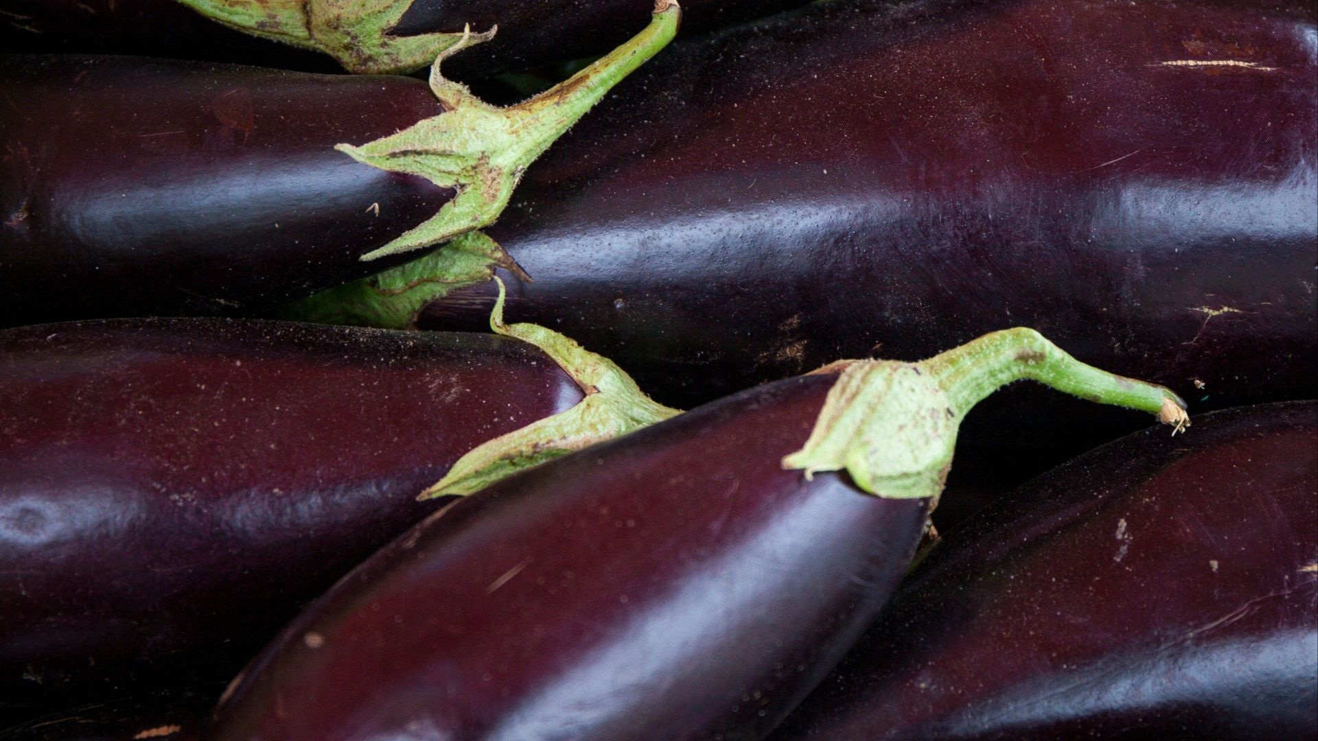 red round fruit on brown wooden table