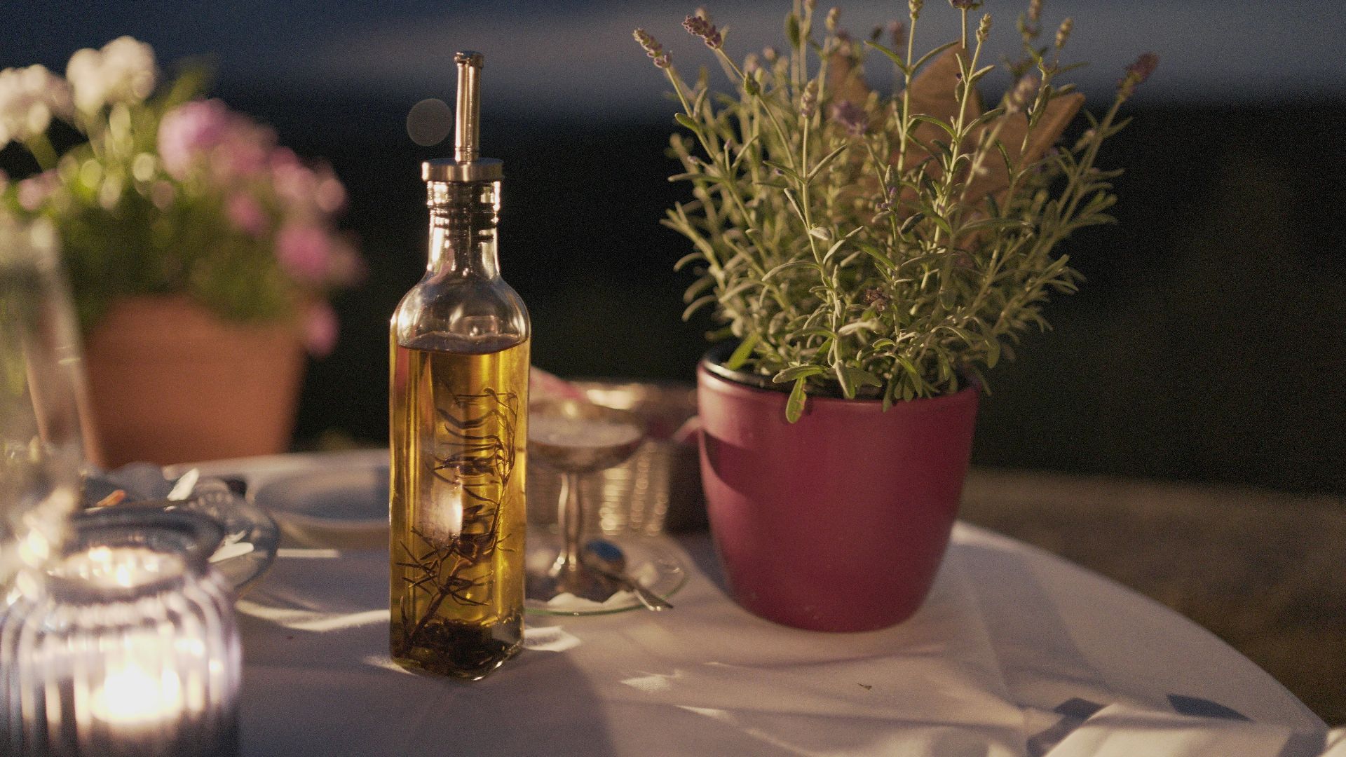 clear glass bottle beside plant