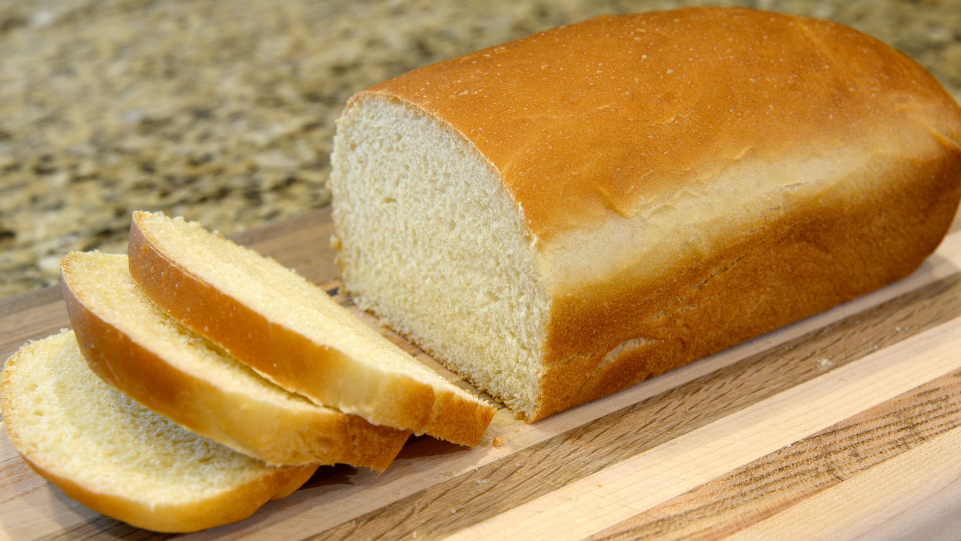 bread on brown wooden chopping board
