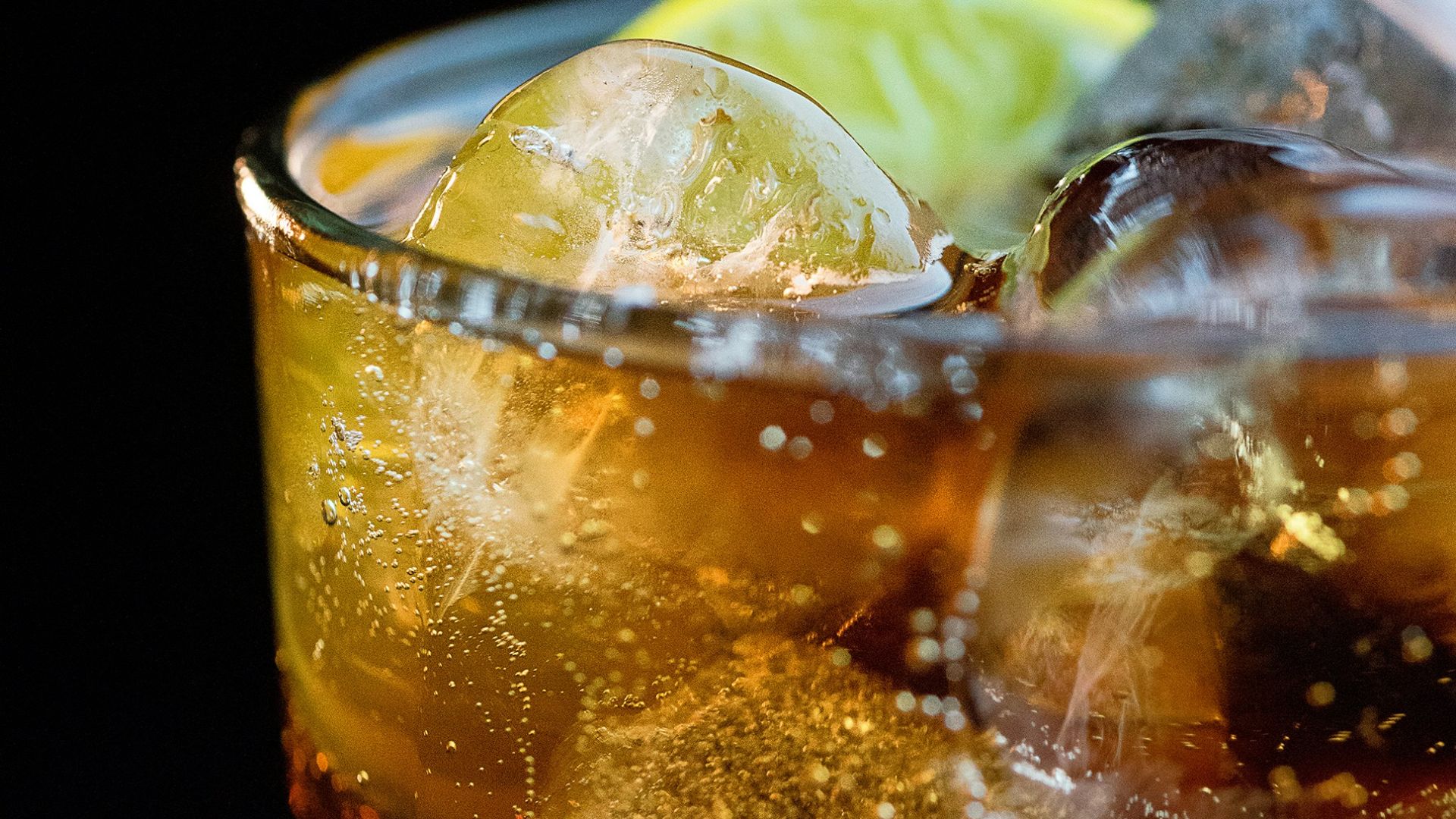 clear drinking glass with ice cubes and lemon