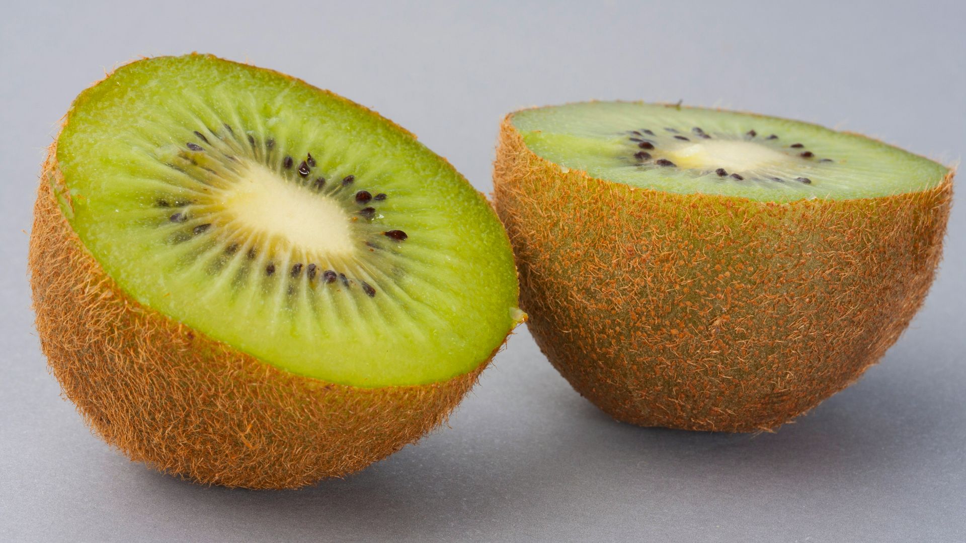 sliced green fruit on white surface