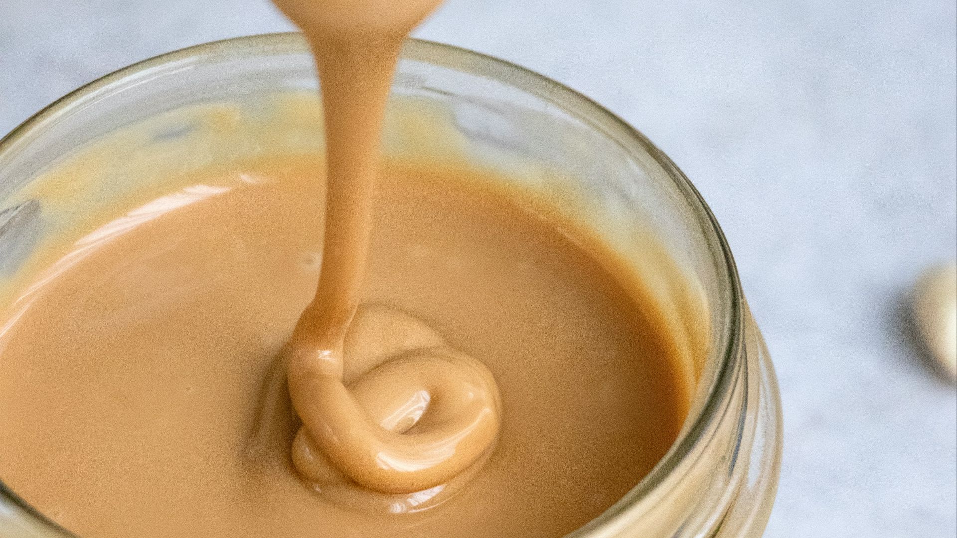 clear glass jar with brown liquid