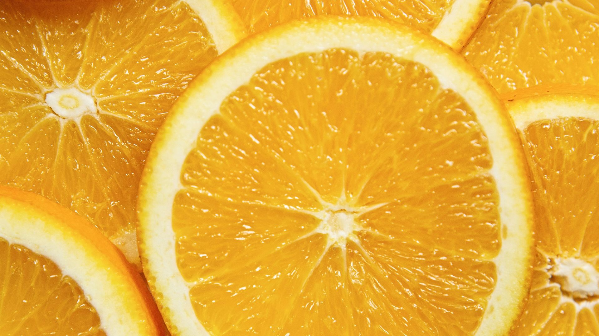 sliced orange fruit on white ceramic plate