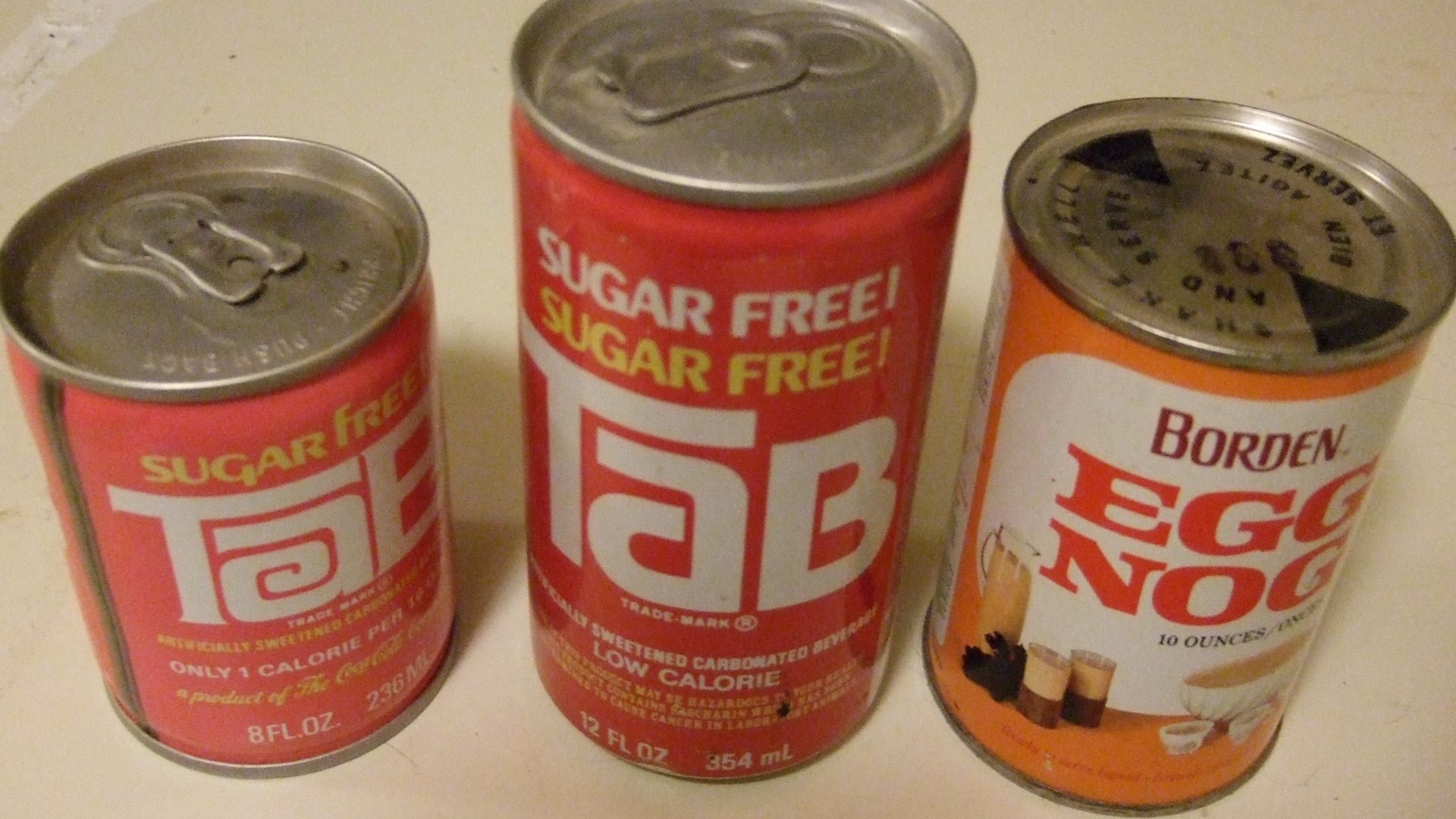 File:Vintage Tab soda cans and egg nog can.jpeg