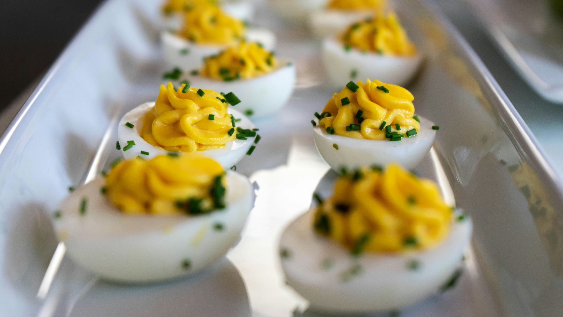 white and yellow icing covered cupcakes
