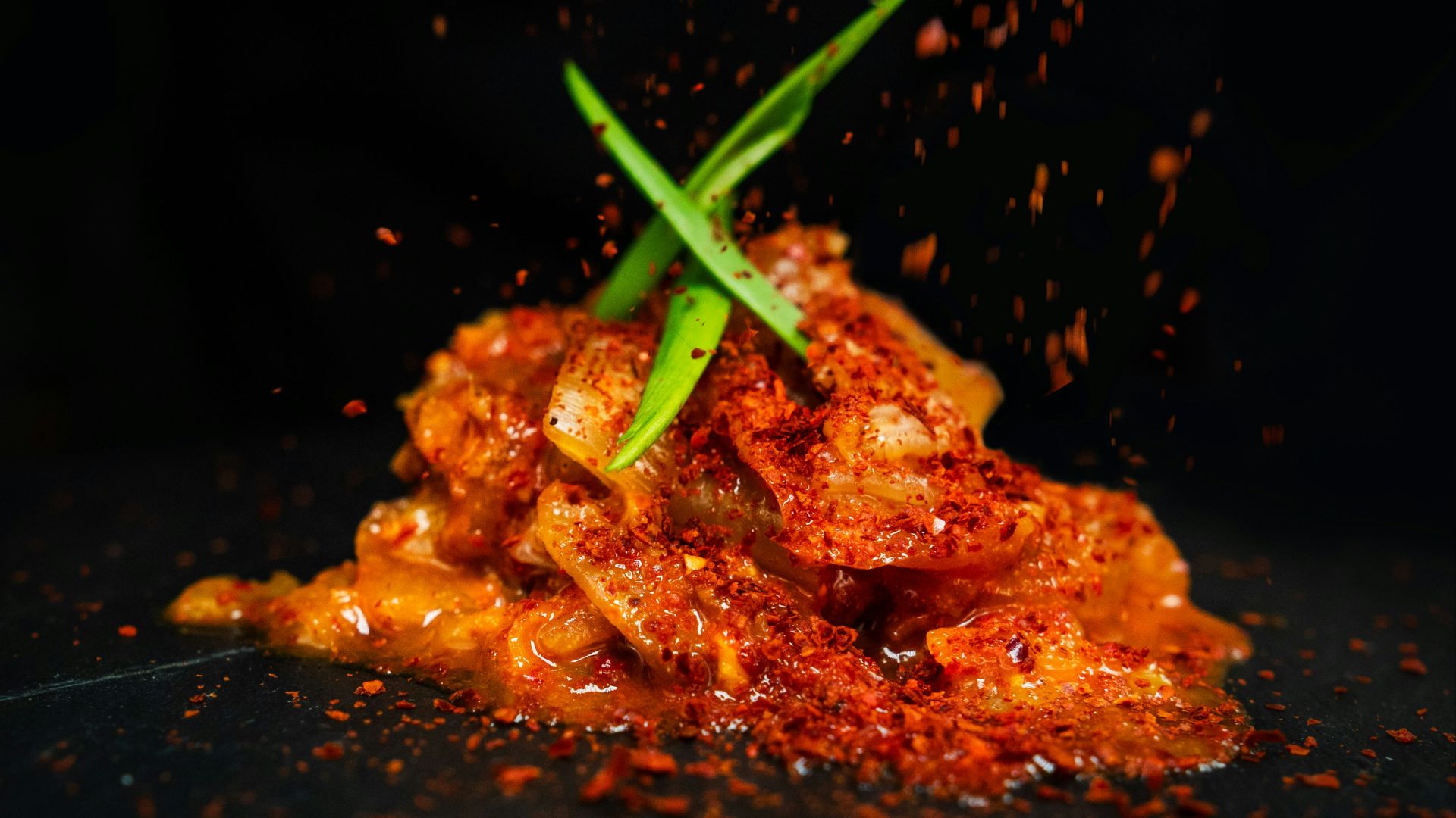 brown and green food on black surface