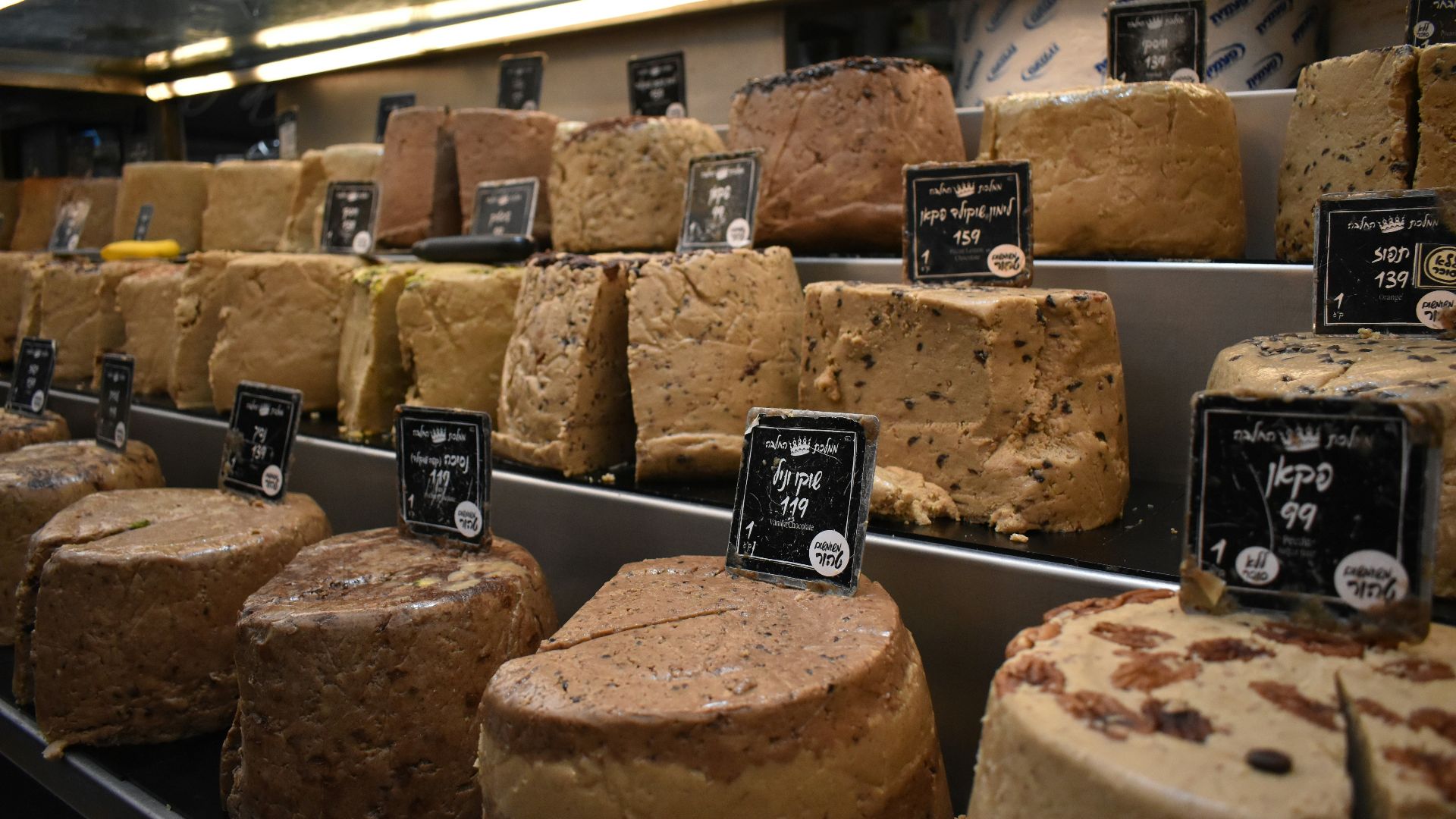 a display case filled with lots of different types of cakes