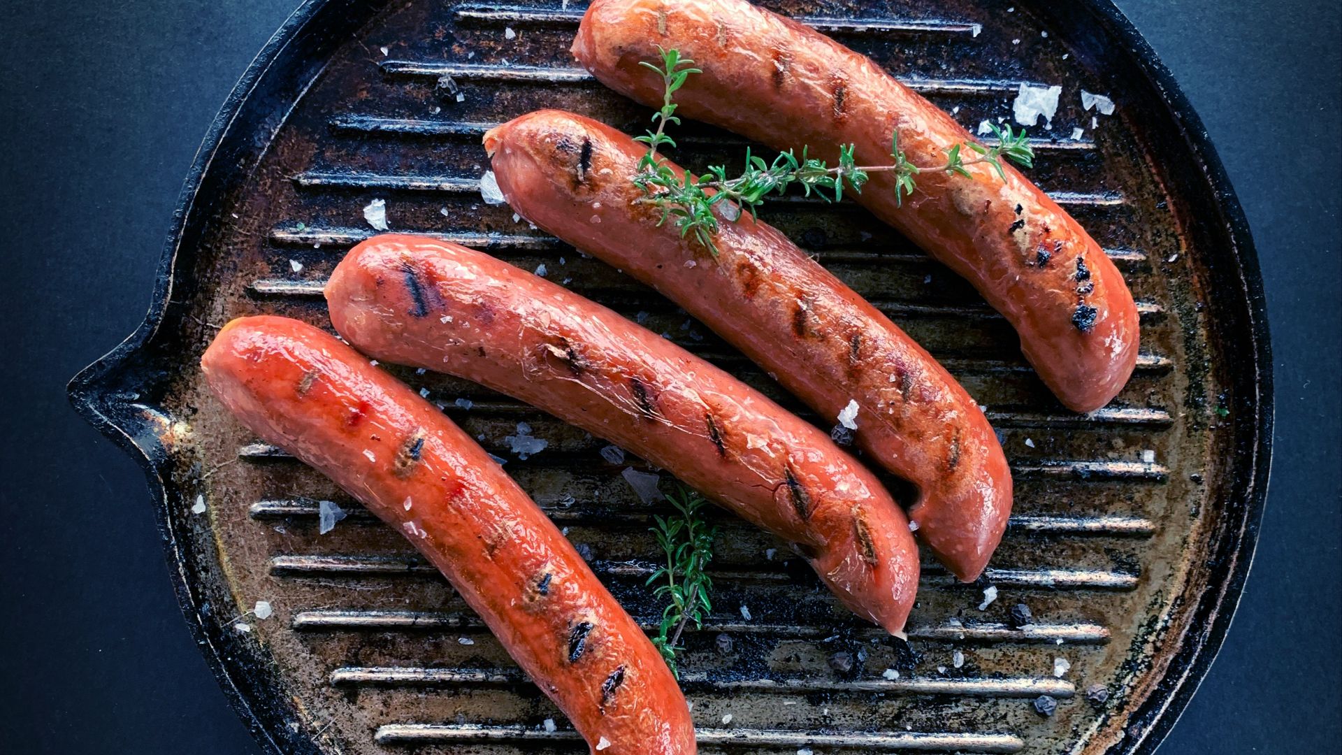 sausage on black round pan