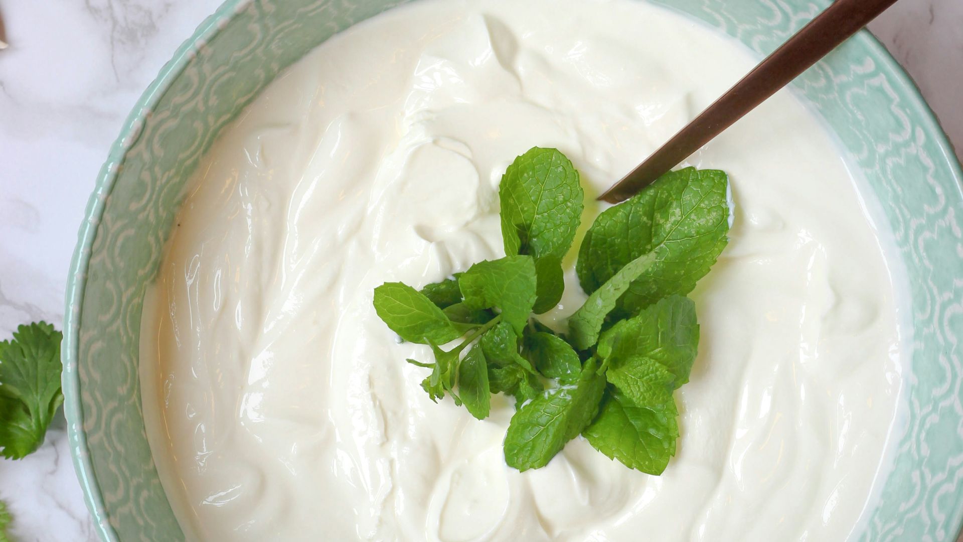 a bowl of yogurt with a spoon in it