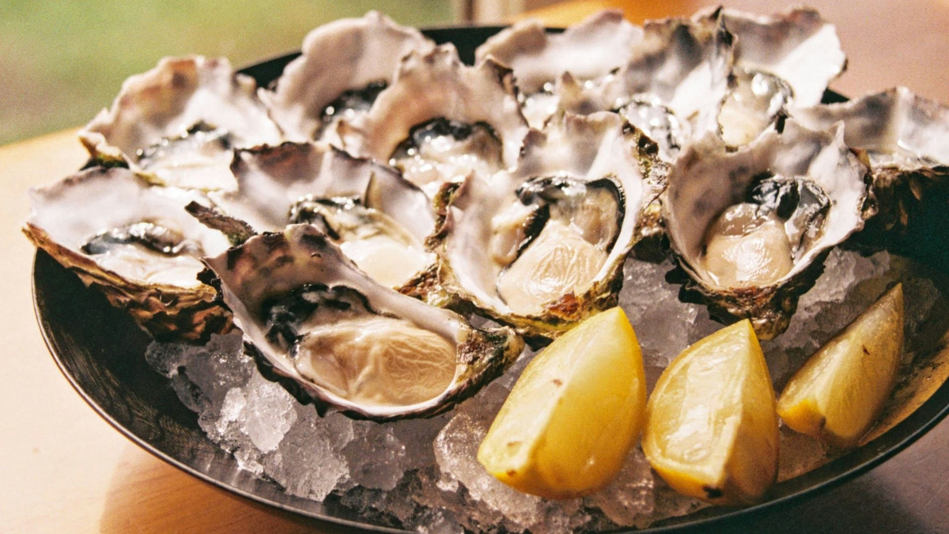 sliced lemon on black plate
