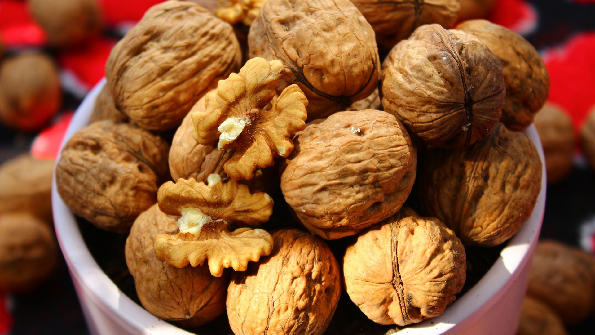 brown round fruit in white plastic container