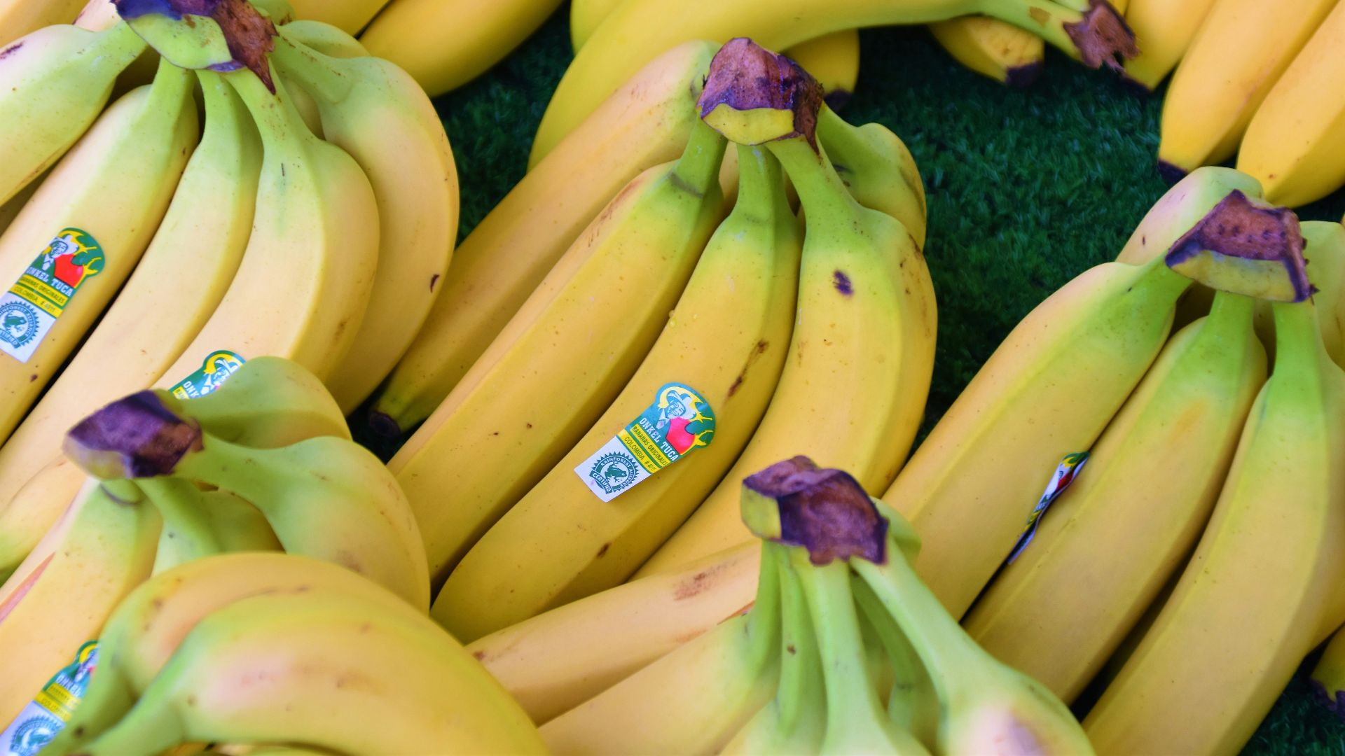 yellow banana fruit on blue textile