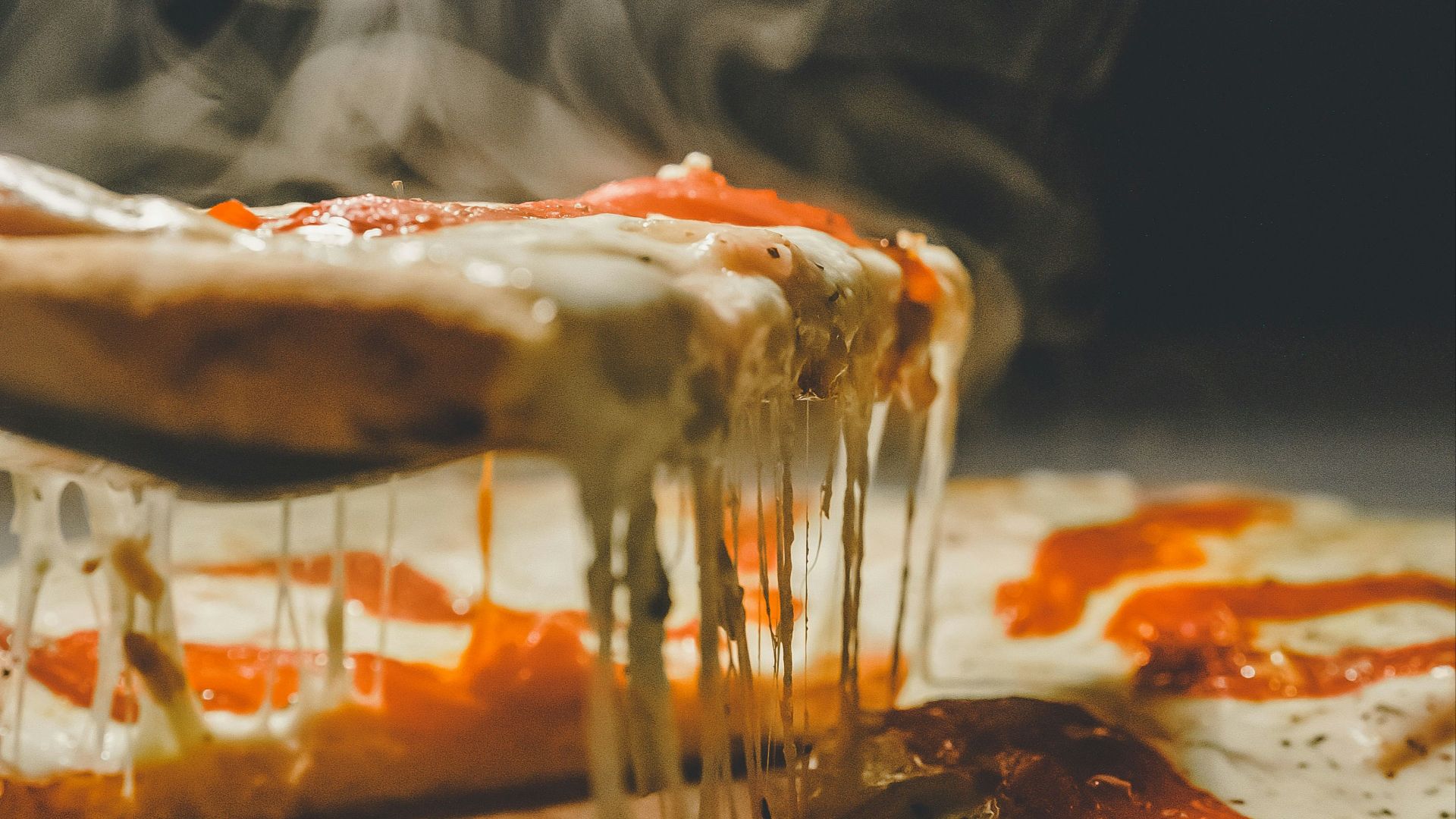 close up photo of pizza with cheese