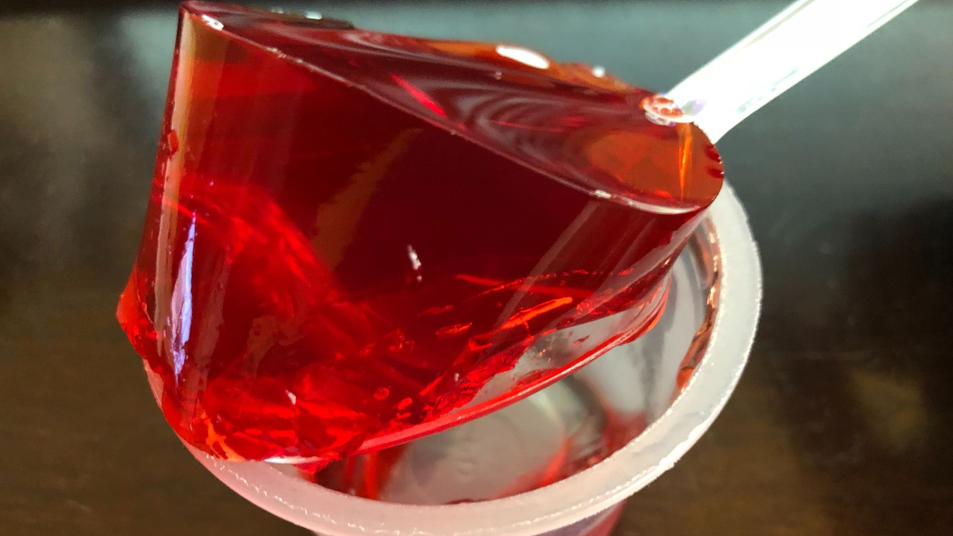 File:2019-10-10 22 15 43 Gelatin from a single opened cup of Jell-O strawberry gelatin snack being lifted by a spoon in the Franklin Farm section of Oak Hill, Fairfax County, Virginia.jpg