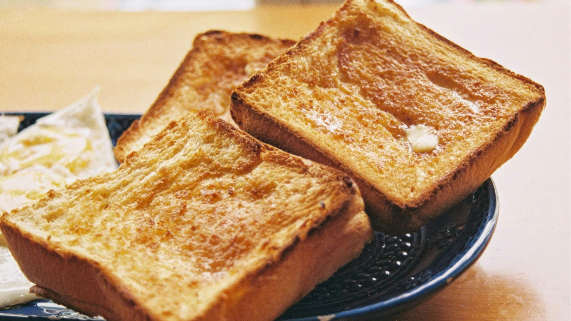 toasted bread on black round plate